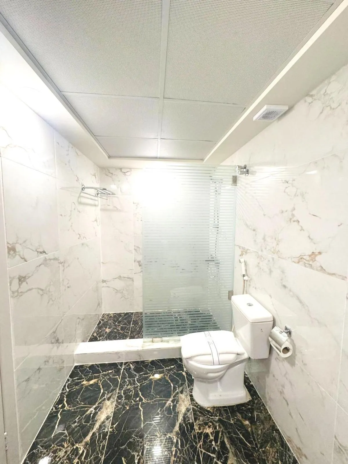 Bathroom in Queens Suite Hotel