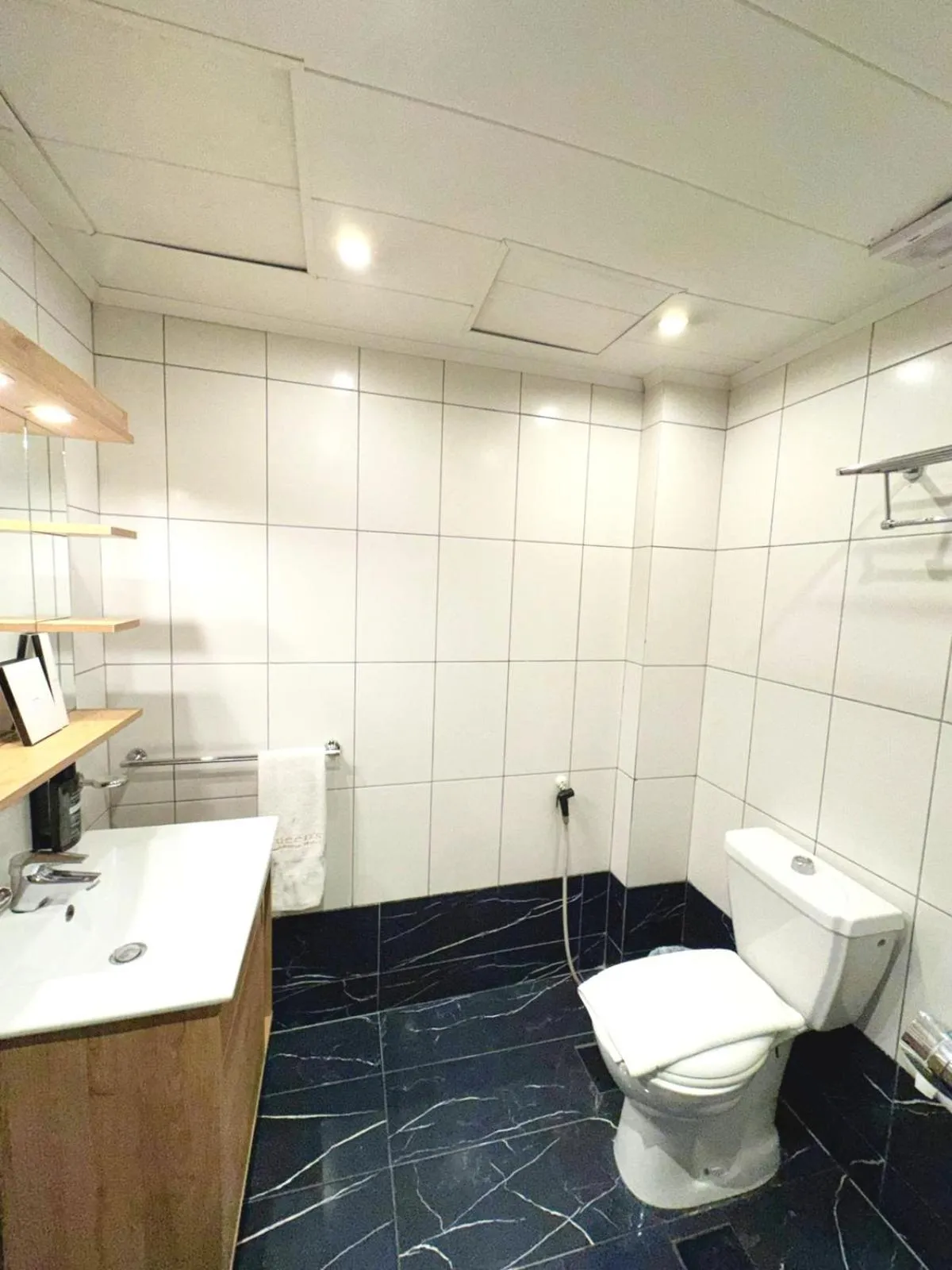 Bathroom in Queens Suite Hotel