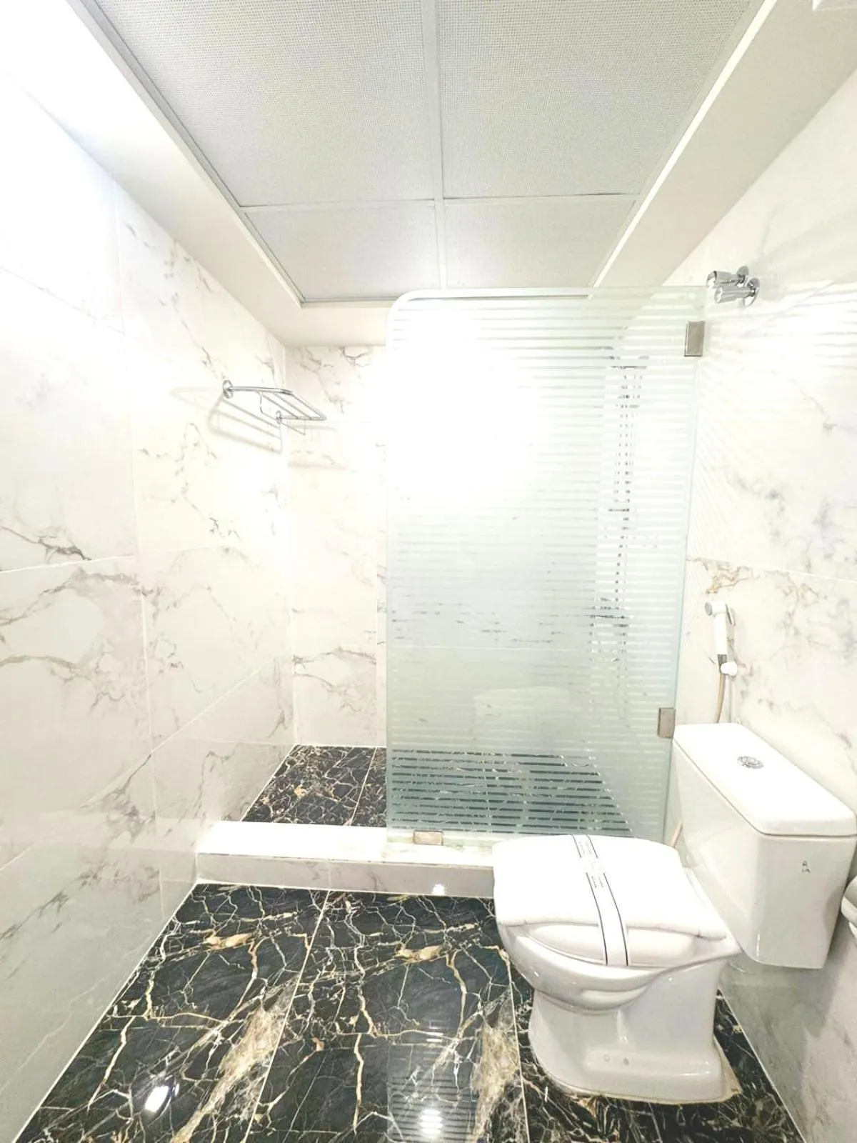 Bathroom in Queens Suite Hotel