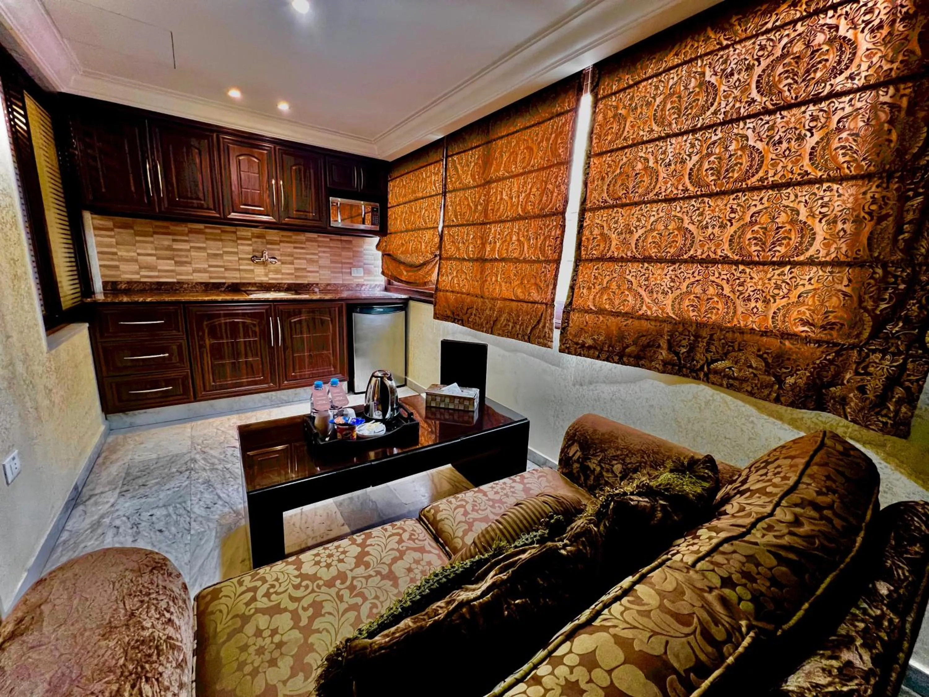 Kitchen or kitchenette in Queens Suite Hotel