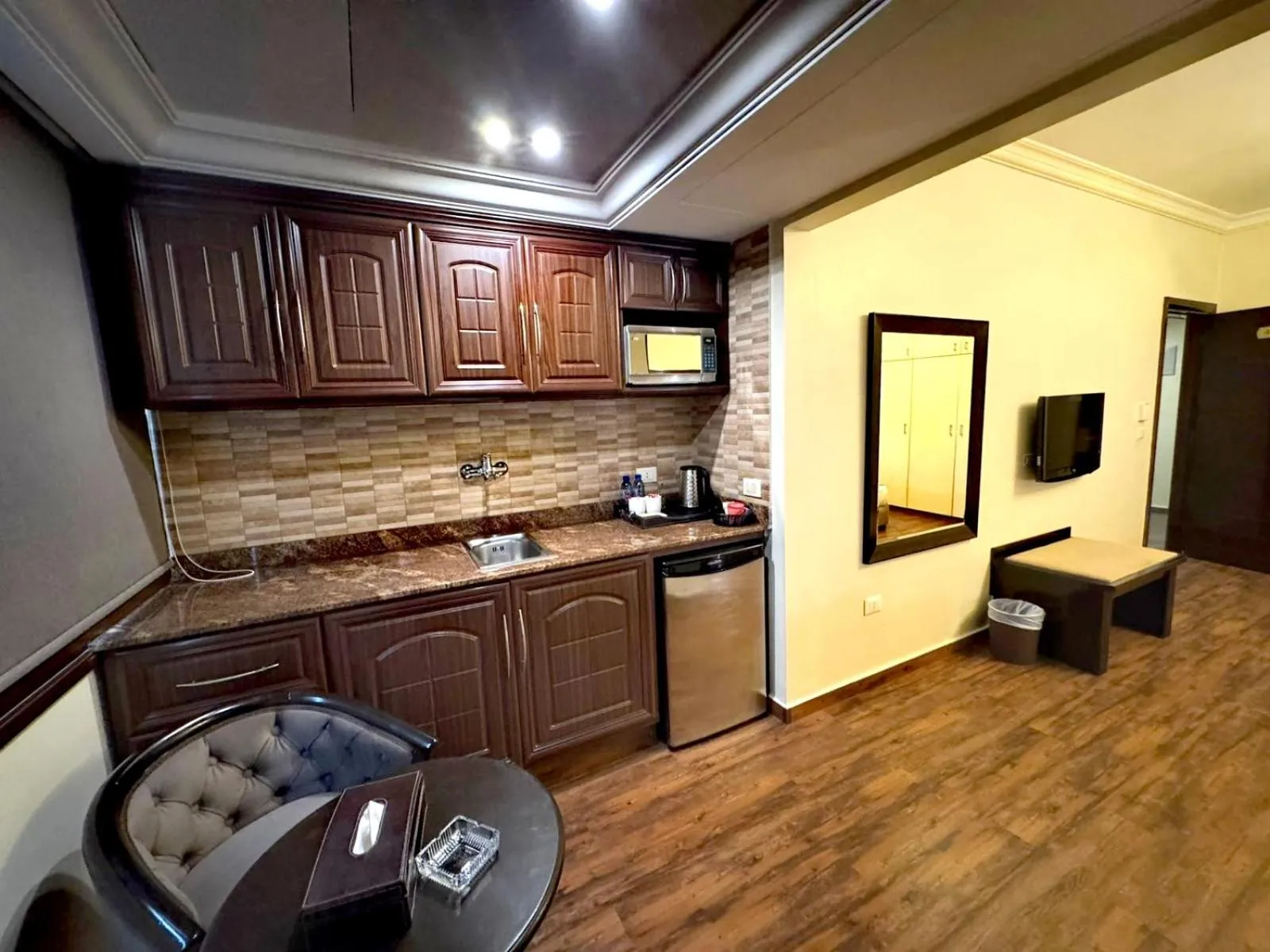 Kitchen or kitchenette in Queens Suite Hotel