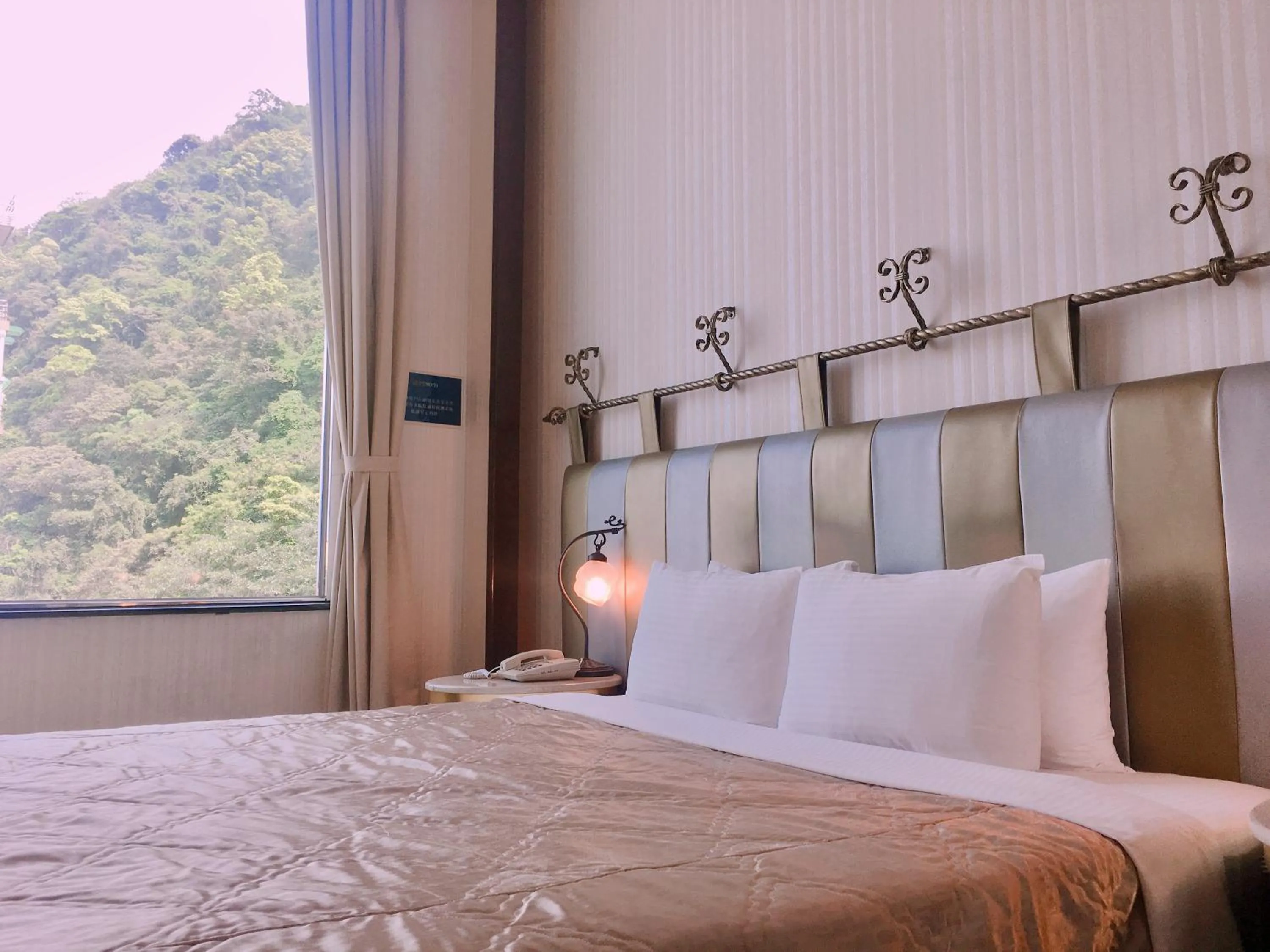 Bed in Hi-Star View Hotel