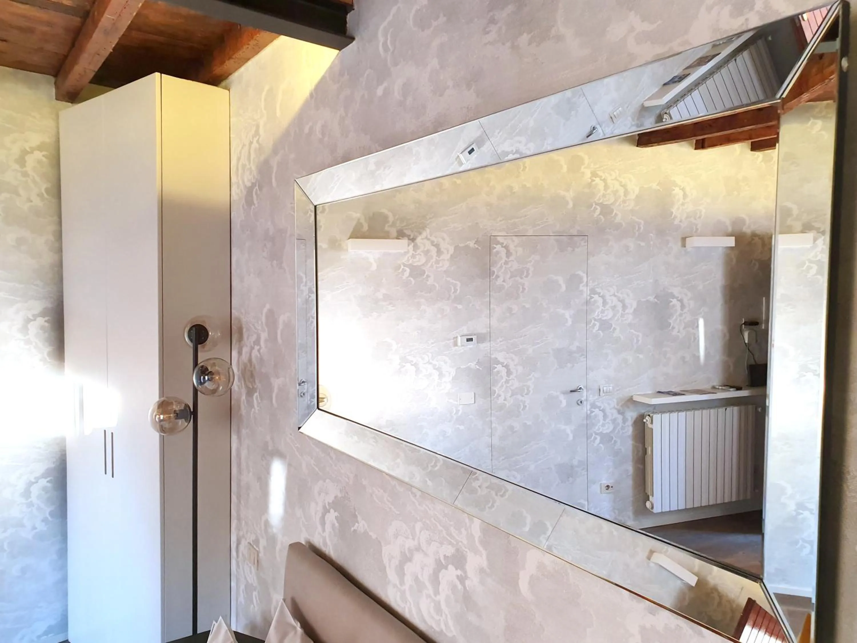 Decorative detail, Bed in Heart Milan Apartments Duomo Colonne