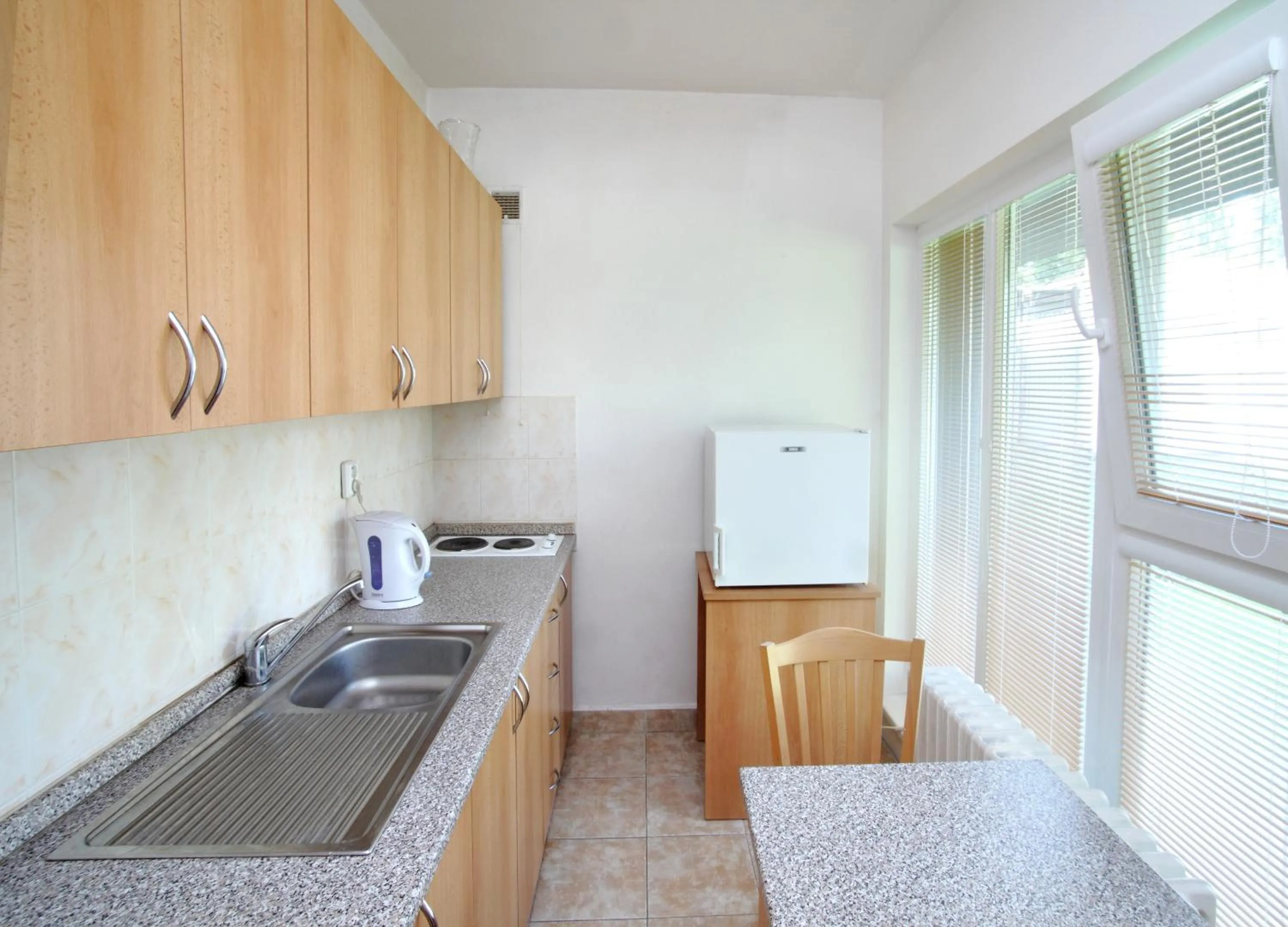Kitchen or kitchenette in Penzion a ubytovna Oáza