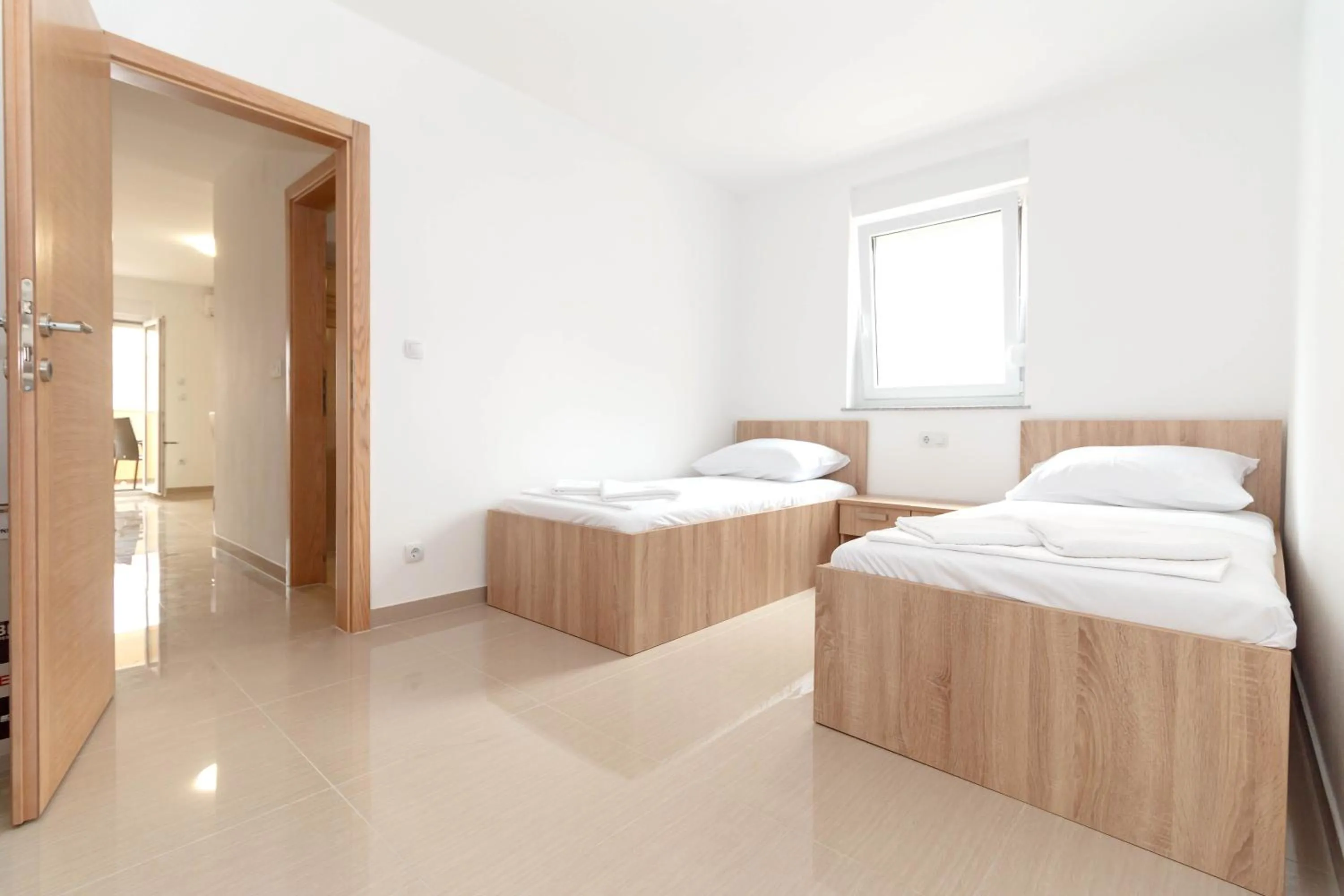 Bed in Summer Fun Apartments
