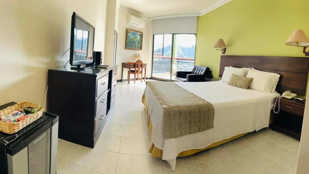 Photo of the whole room, Bed in Casa Morales Hotel Internacional y Centro de Convenciones