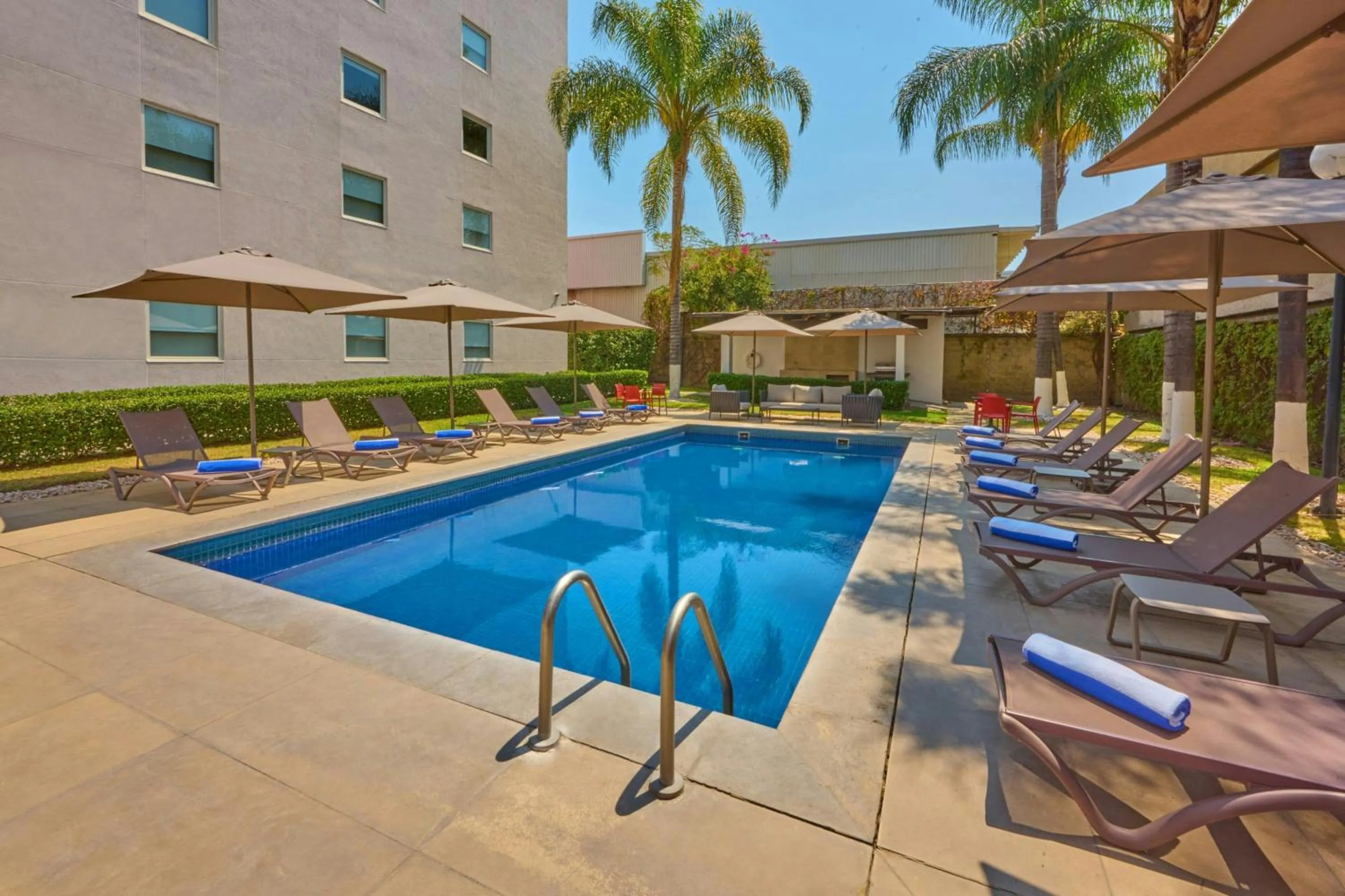Swimming pool in City Express Suites by Marriott Queretaro