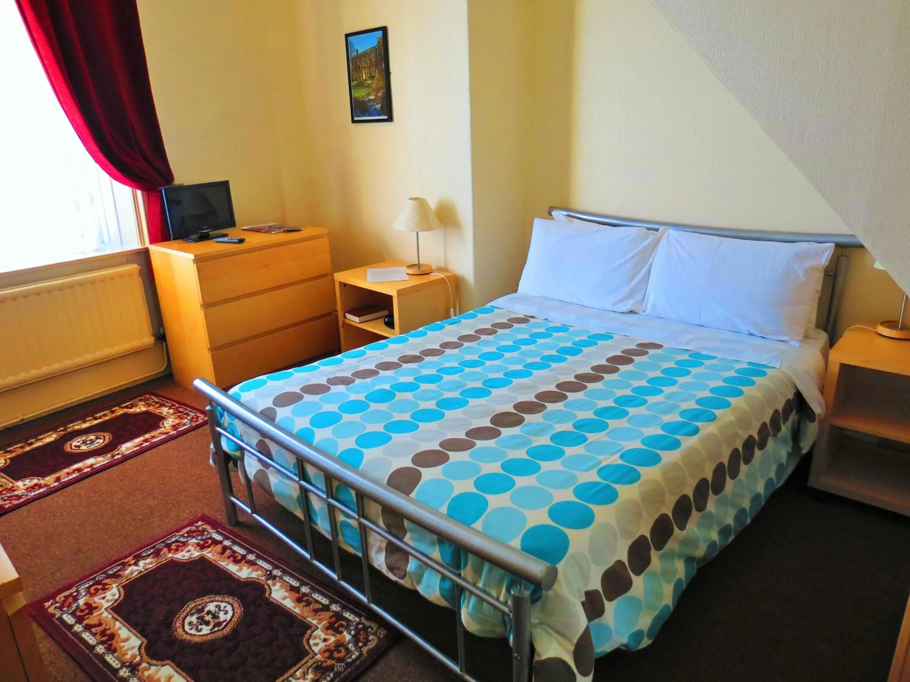 Bed in The Apothecary Guest House