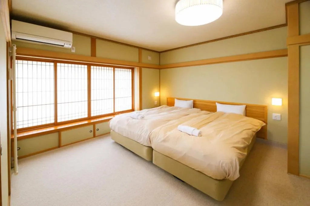 Bed in Tsuru Apartments