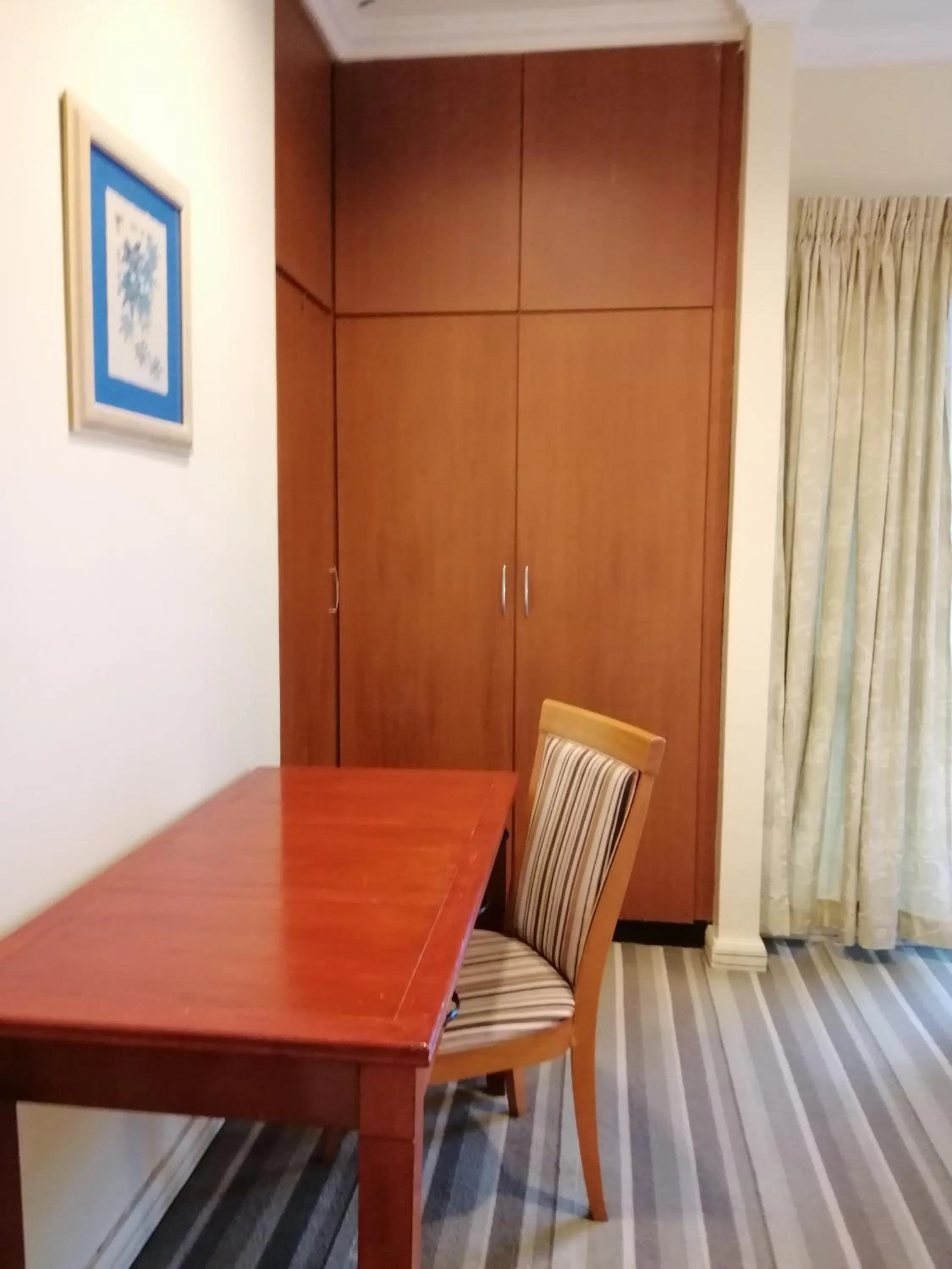 Bedroom in StayInn Gateway Hotel Apartment