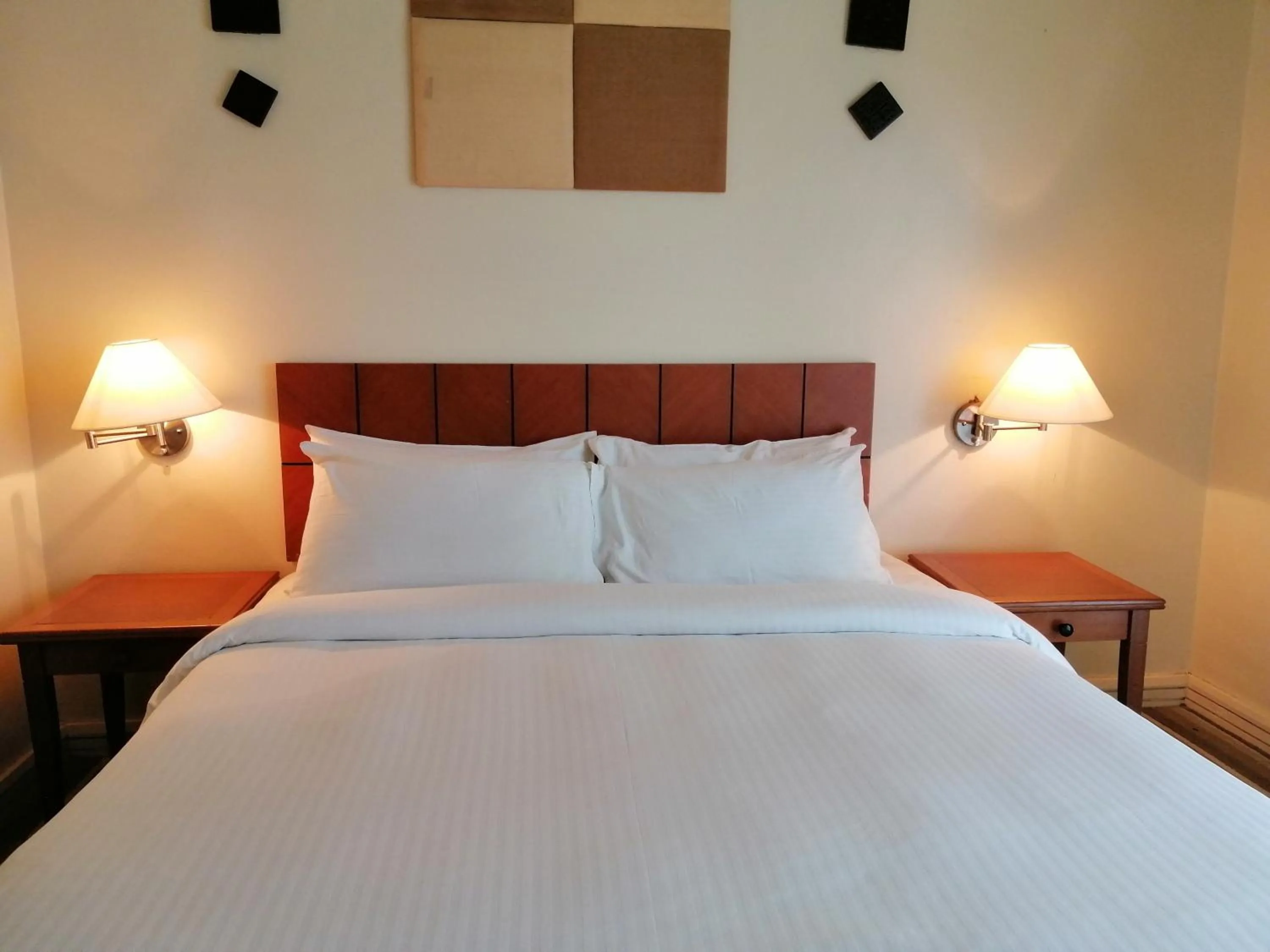 Bed in StayInn Gateway Hotel Apartment