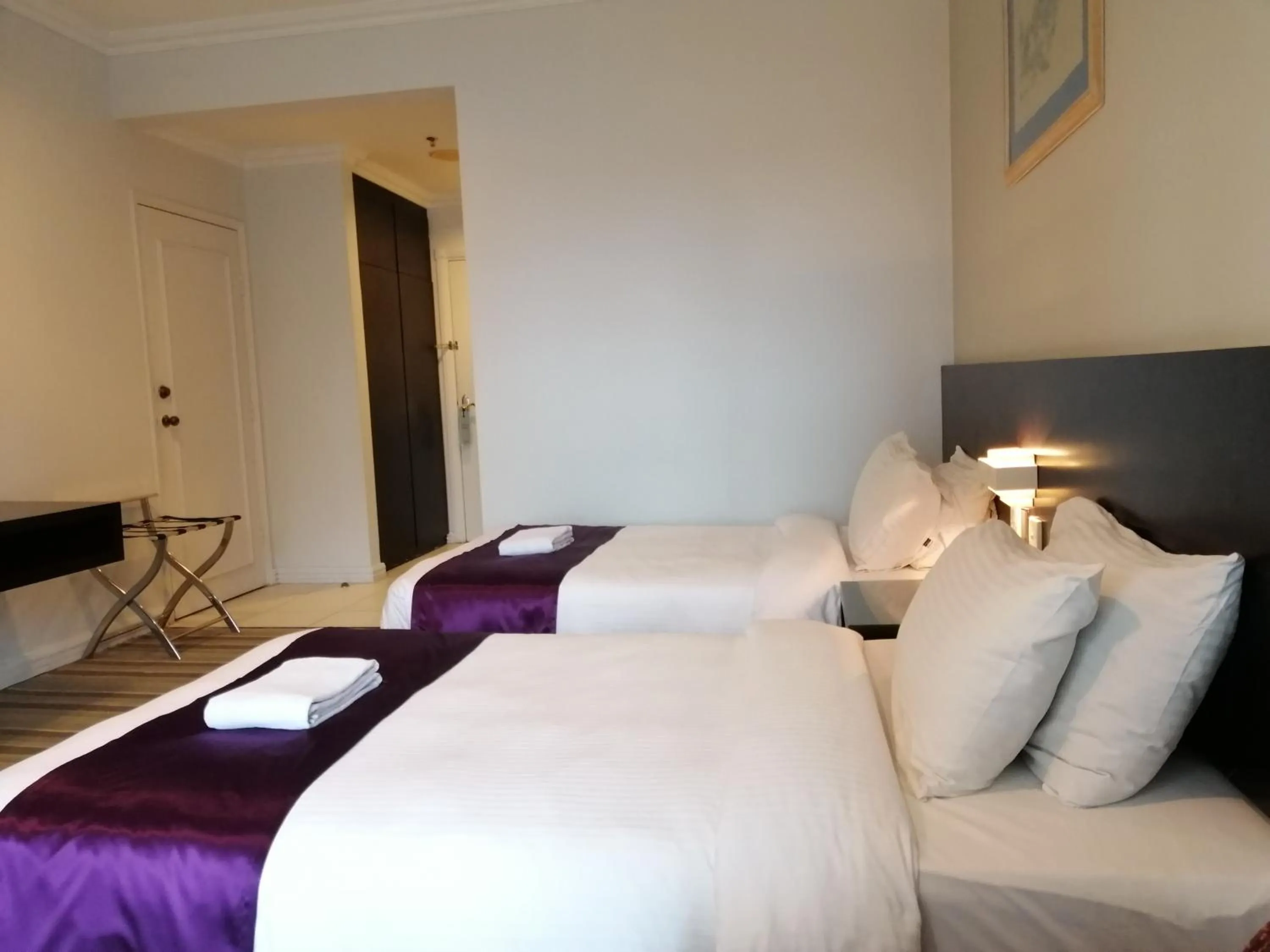 Bed in StayInn Gateway Hotel Apartment