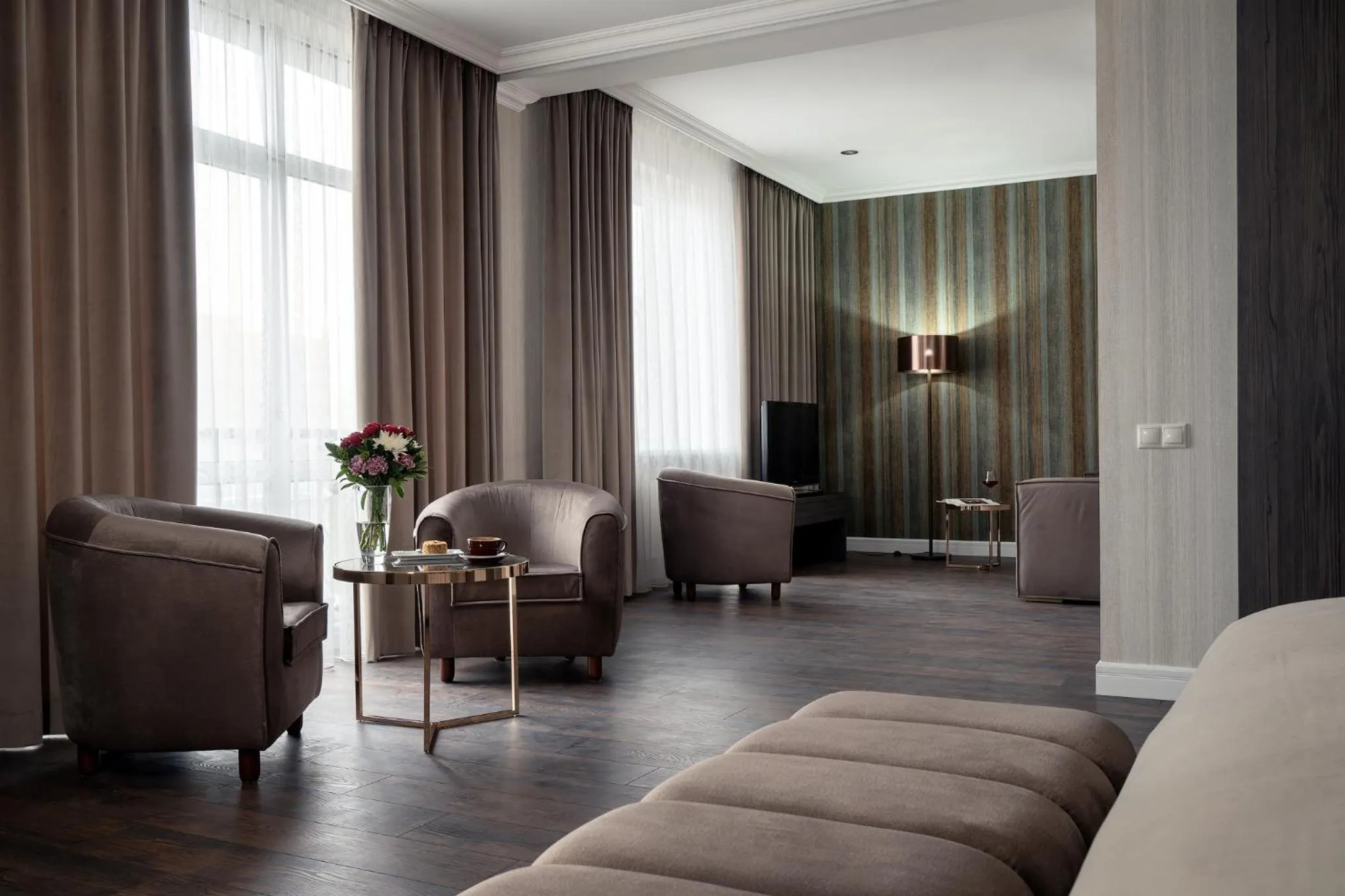 Seating area in Greguar Hotel by UHM