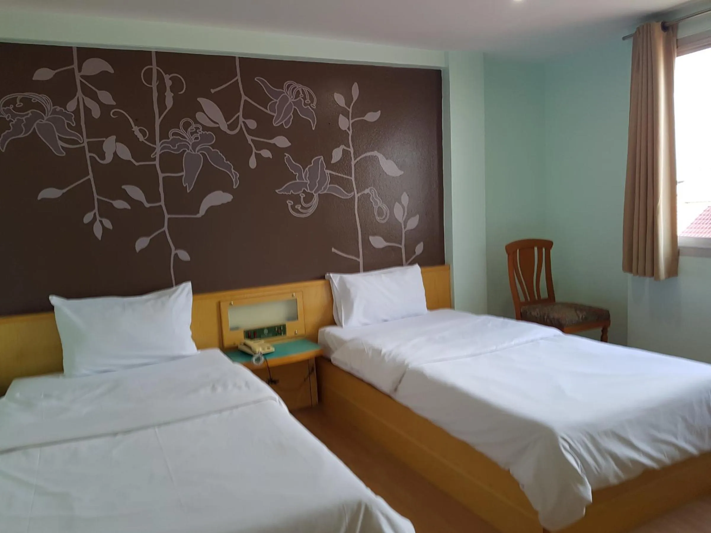 Bed in K.S.Pavilion Hotel