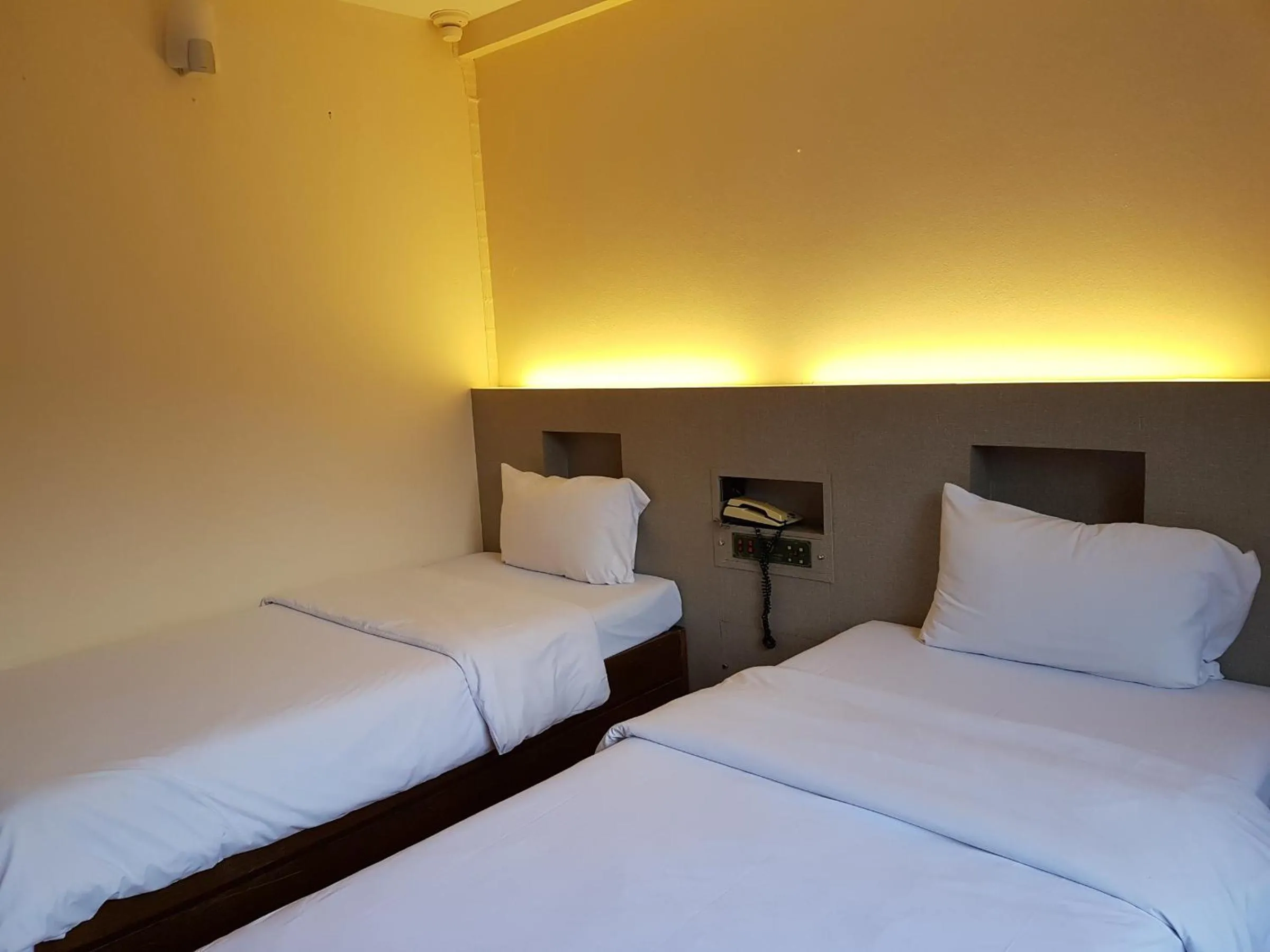 Bed in K.S.Pavilion Hotel