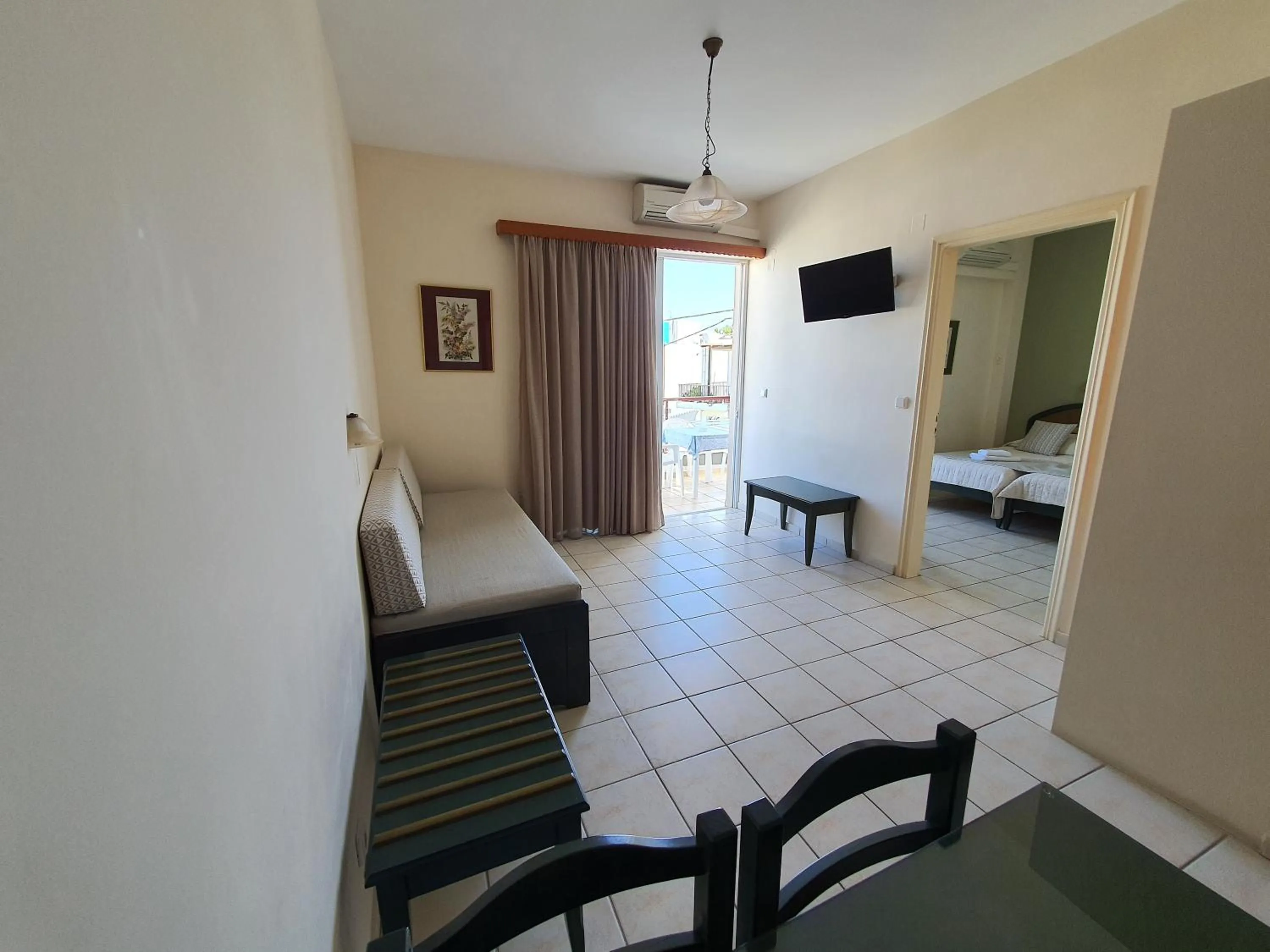 Living room, Bed in Zannis Hotel