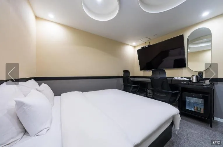 Bed in Jamsil Tomgi Hotel