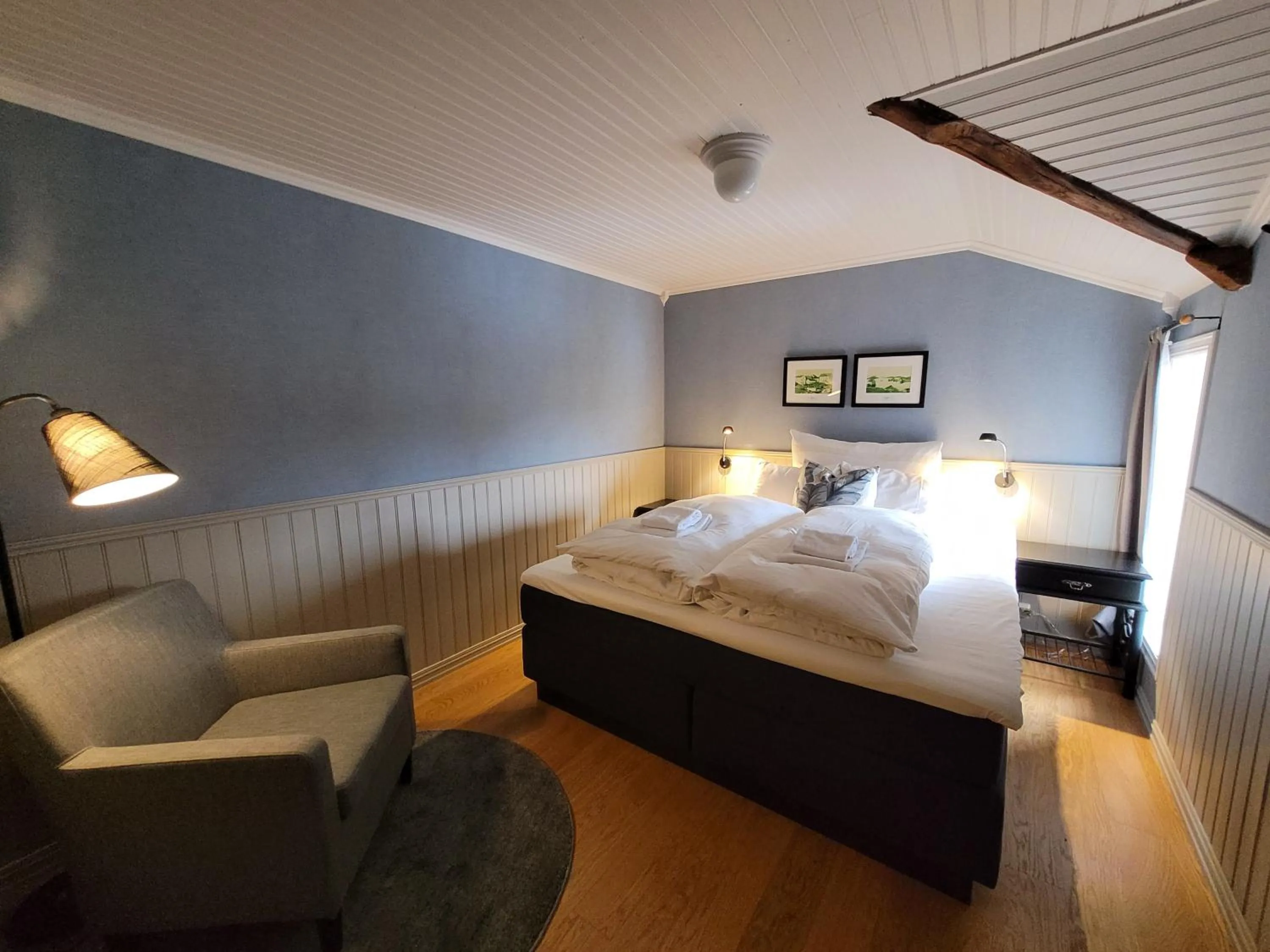 Photo of the whole room, Bed in Ona Havstuer - by Classic Norway Hotels