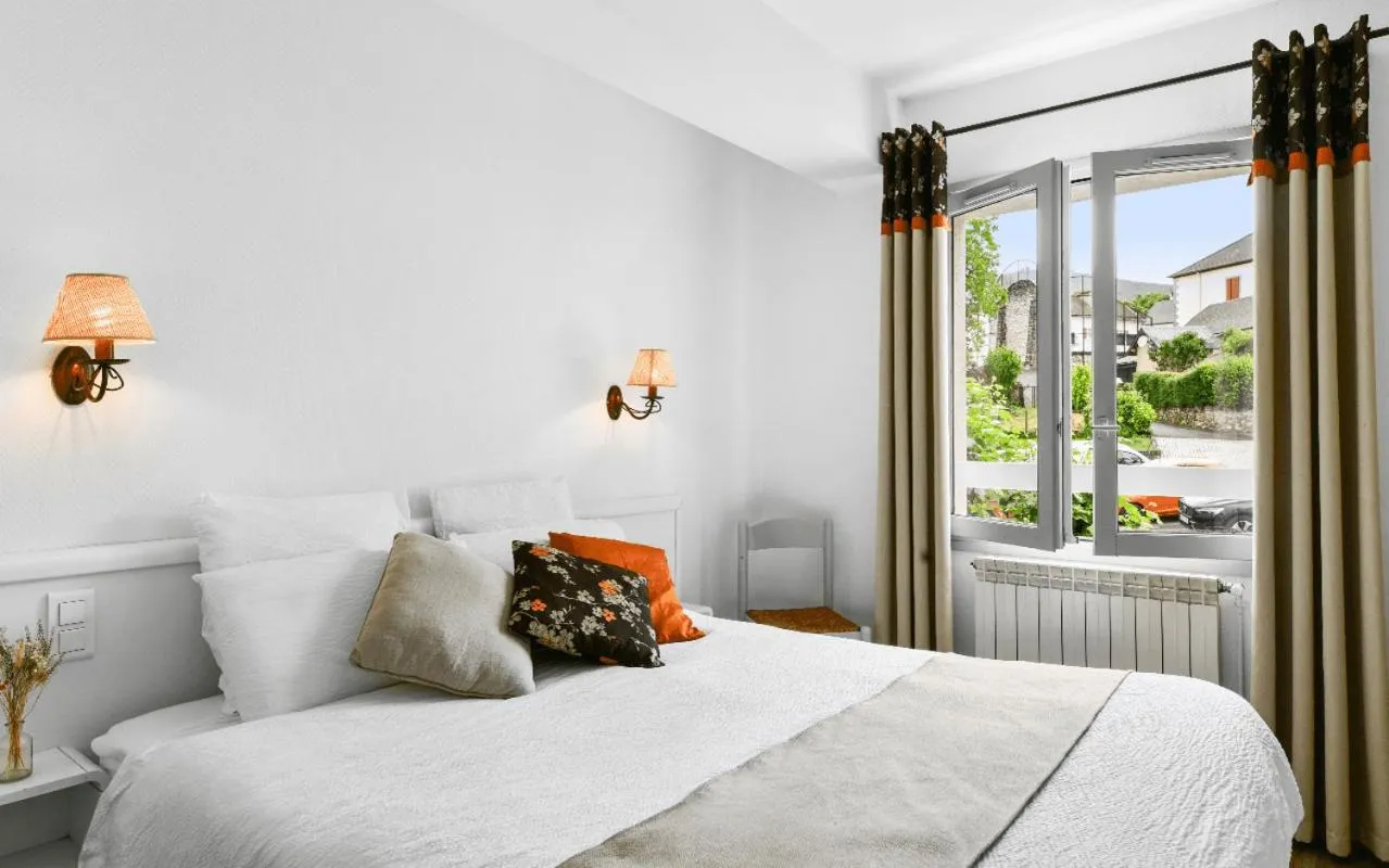 Bed in Logis Hôtel Etchemaïté