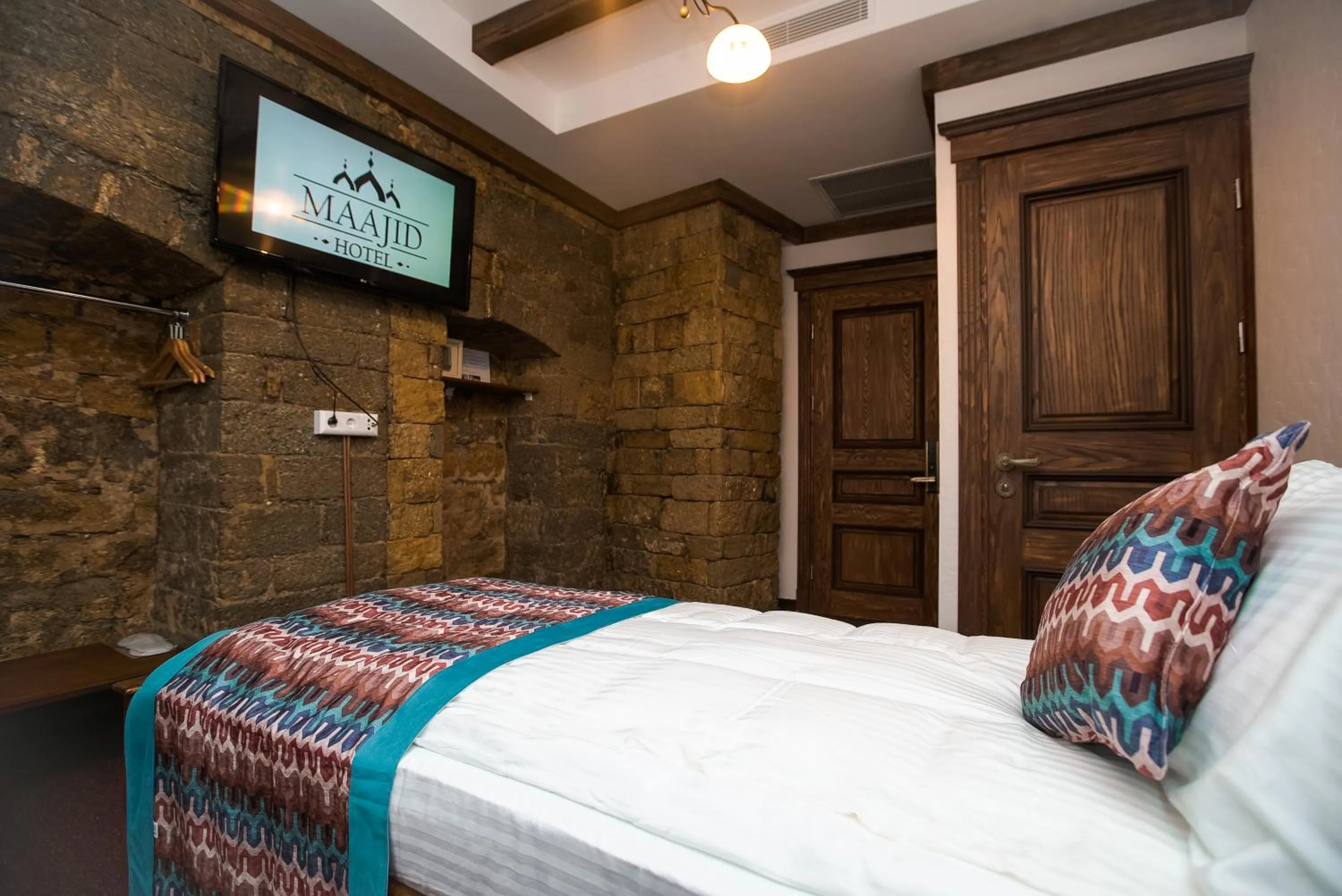 Bed in Maajid Boutique Hotel
