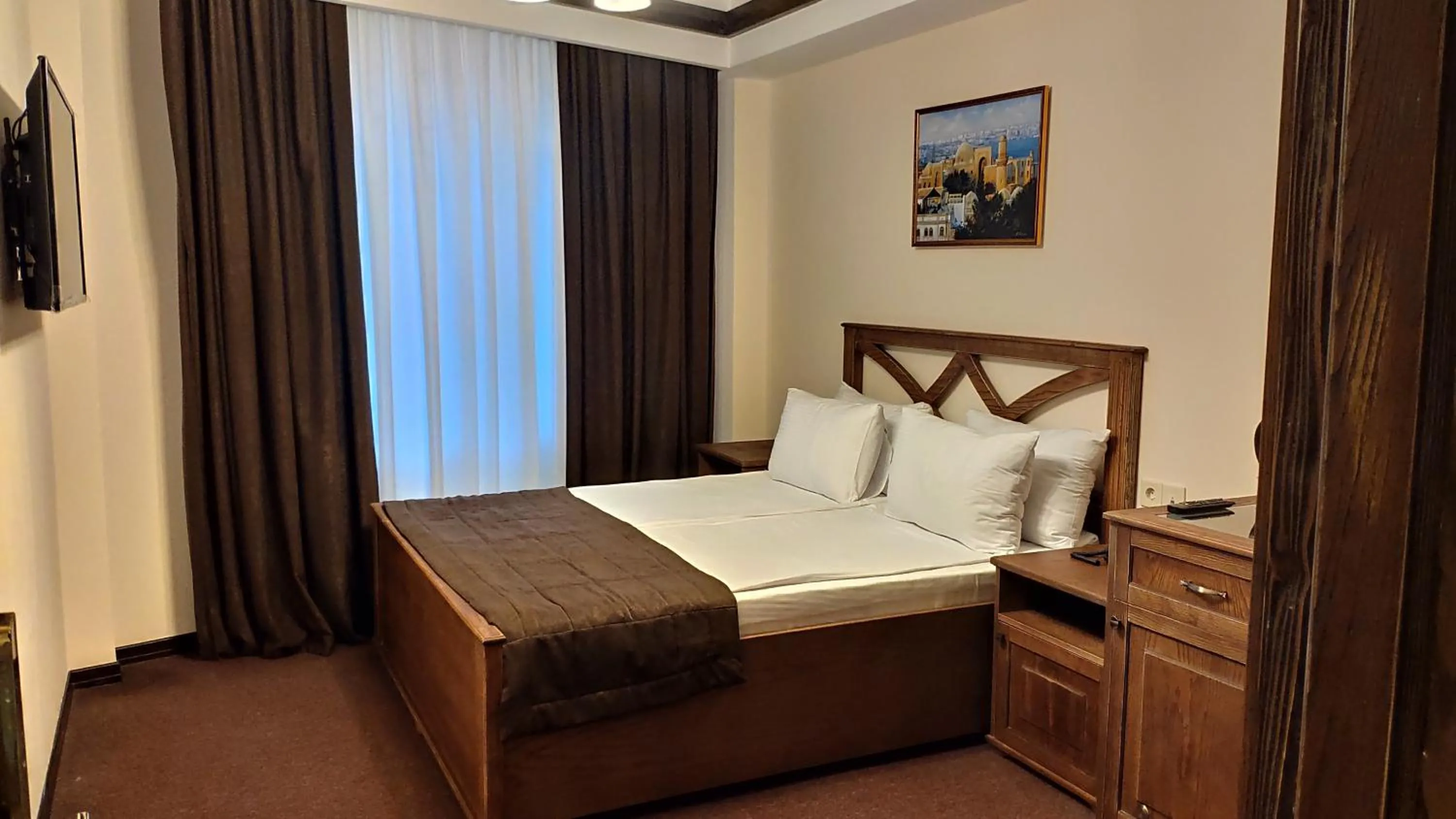 Bed in Maajid Boutique Hotel