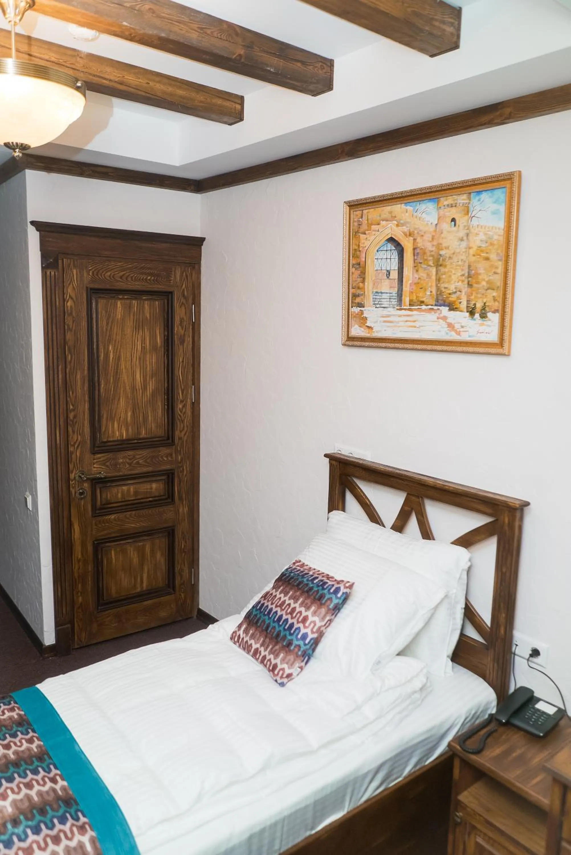 Bed in Maajid Boutique Hotel