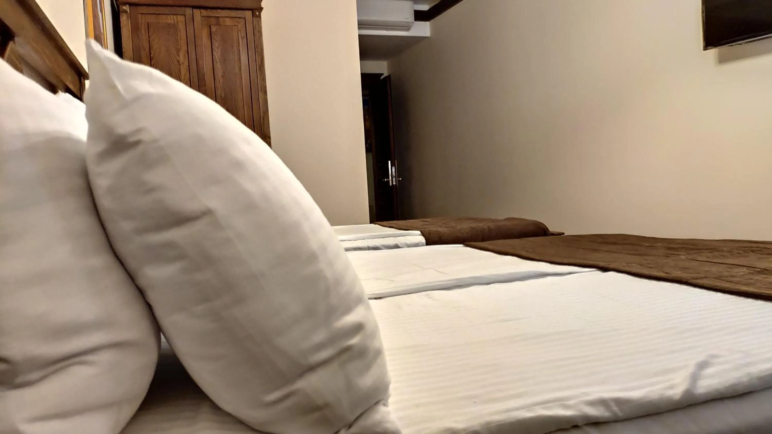 Bed in Maajid Boutique Hotel