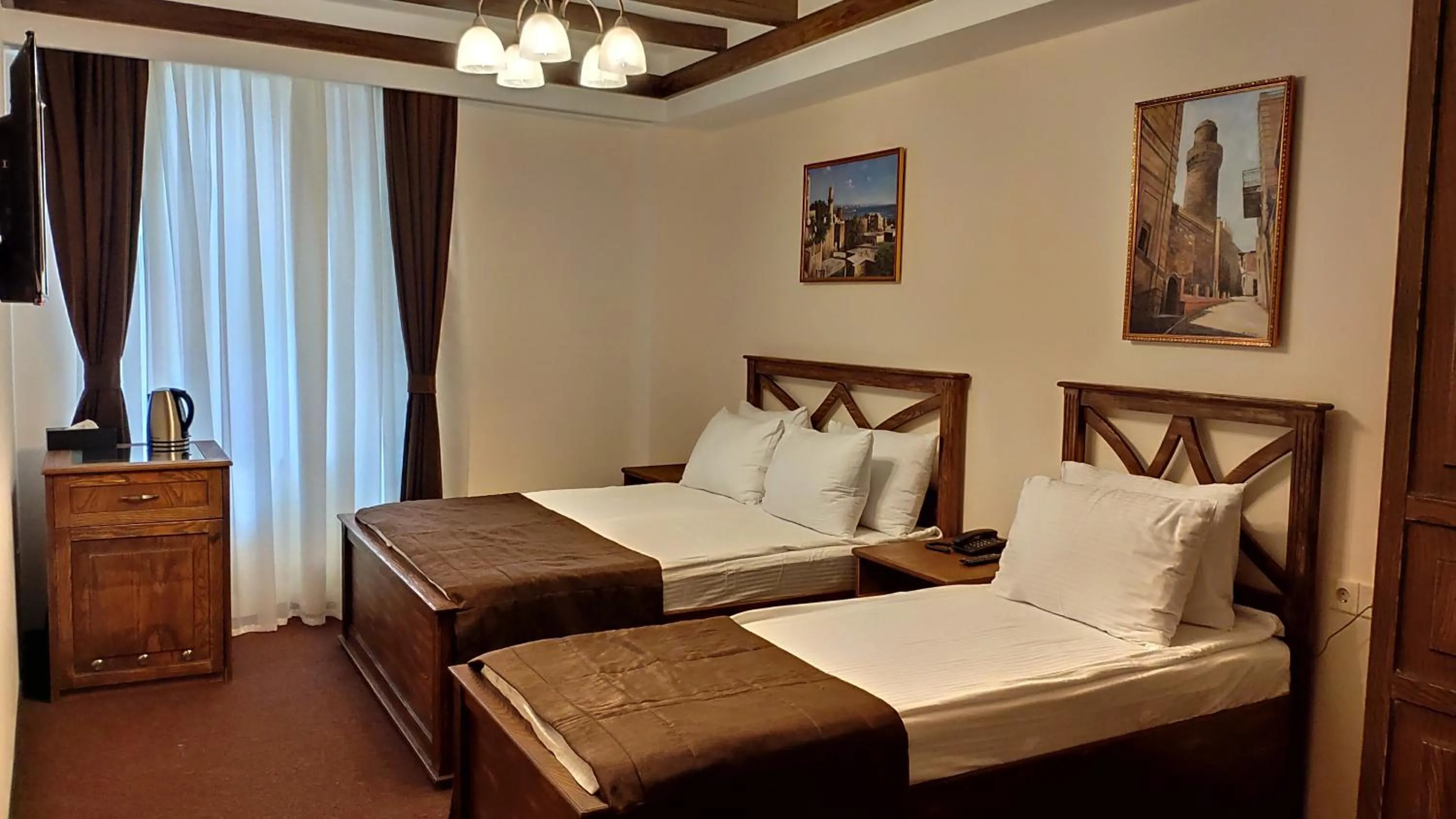 Bed in Maajid Boutique Hotel