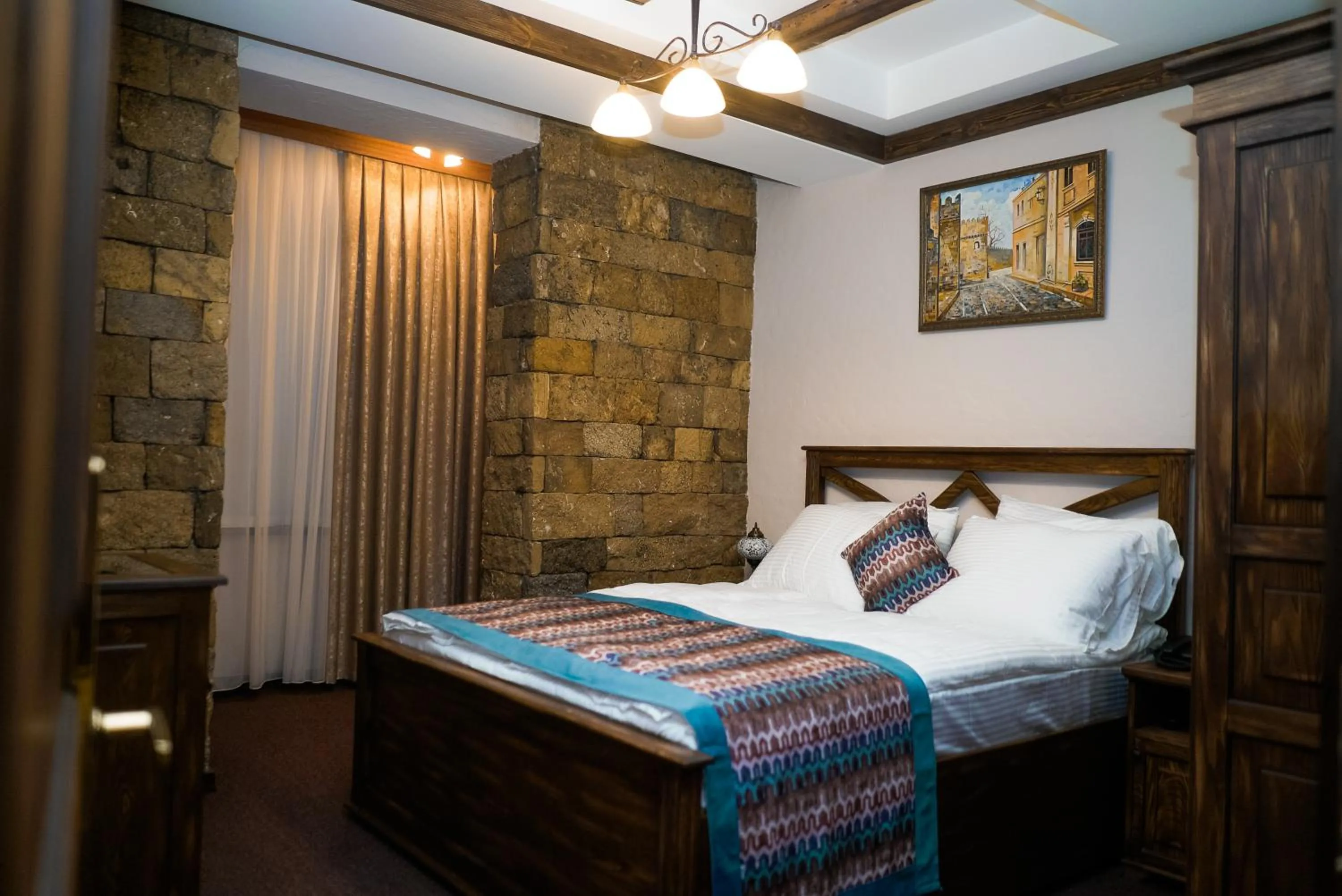 Bed in Maajid Boutique Hotel