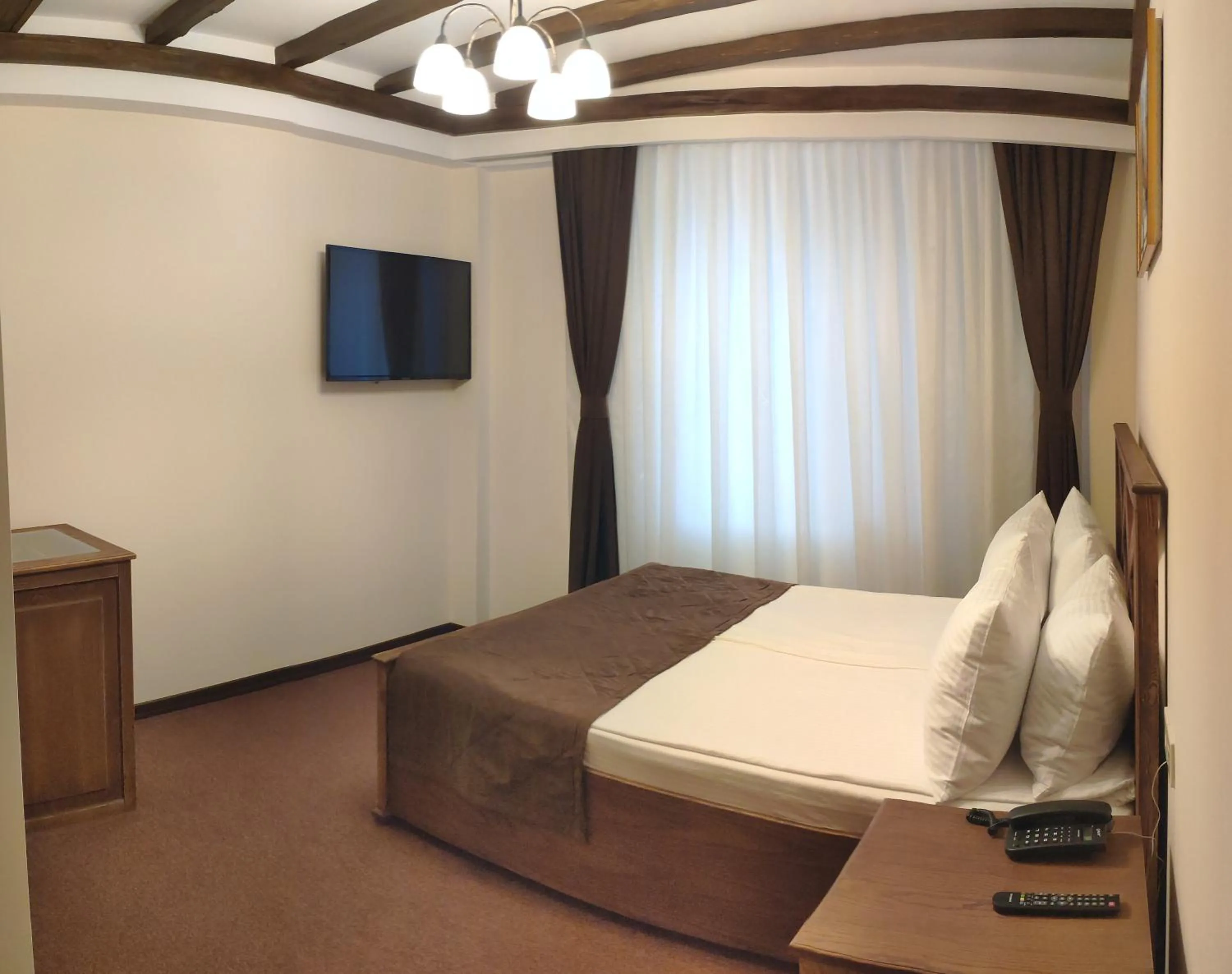 Bed in Maajid Boutique Hotel