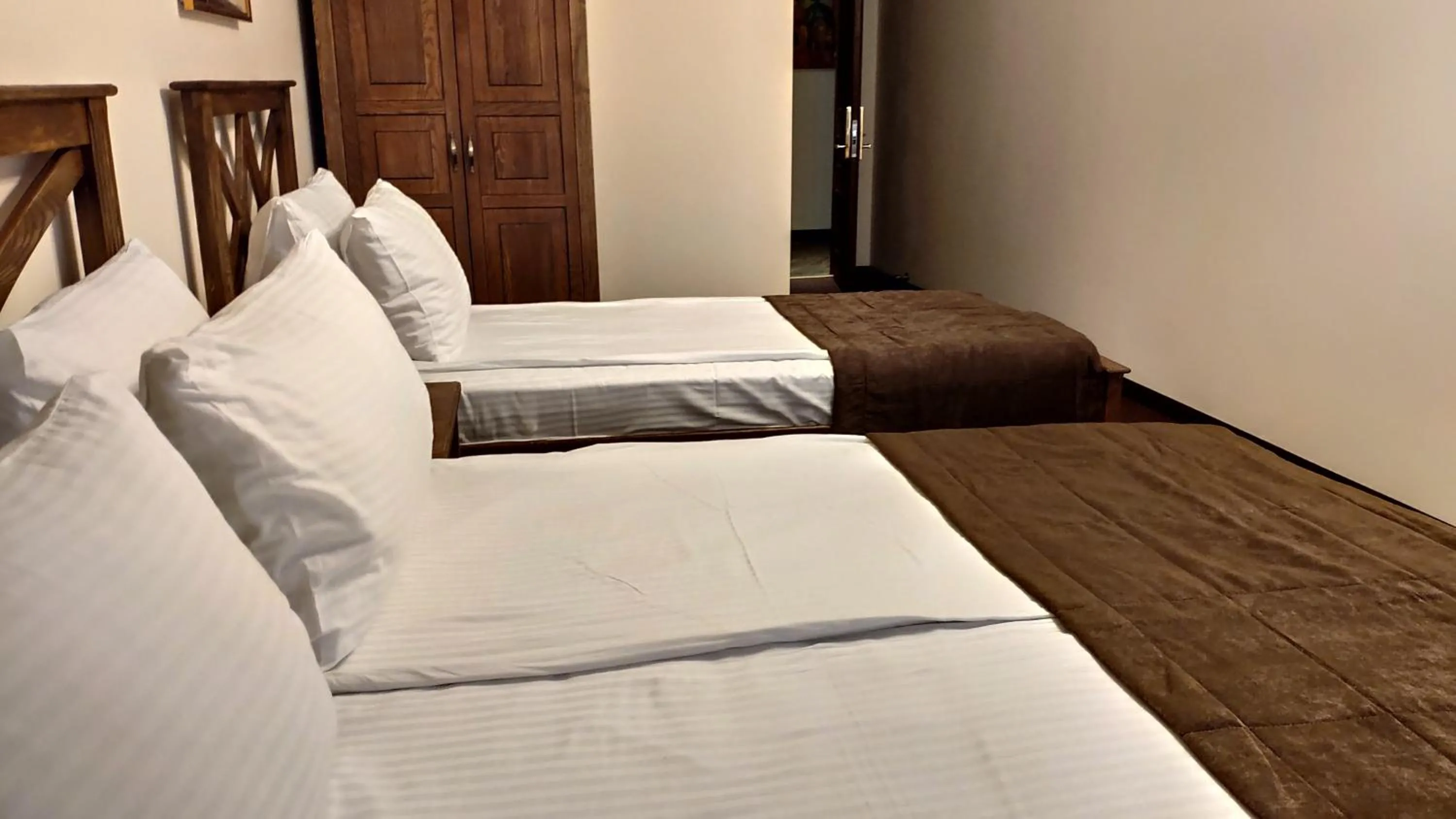 Bed in Maajid Boutique Hotel
