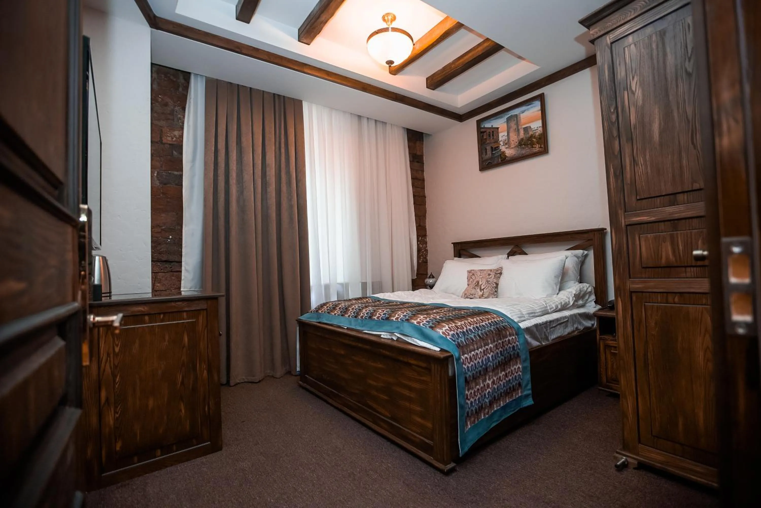 Bed in Maajid Boutique Hotel