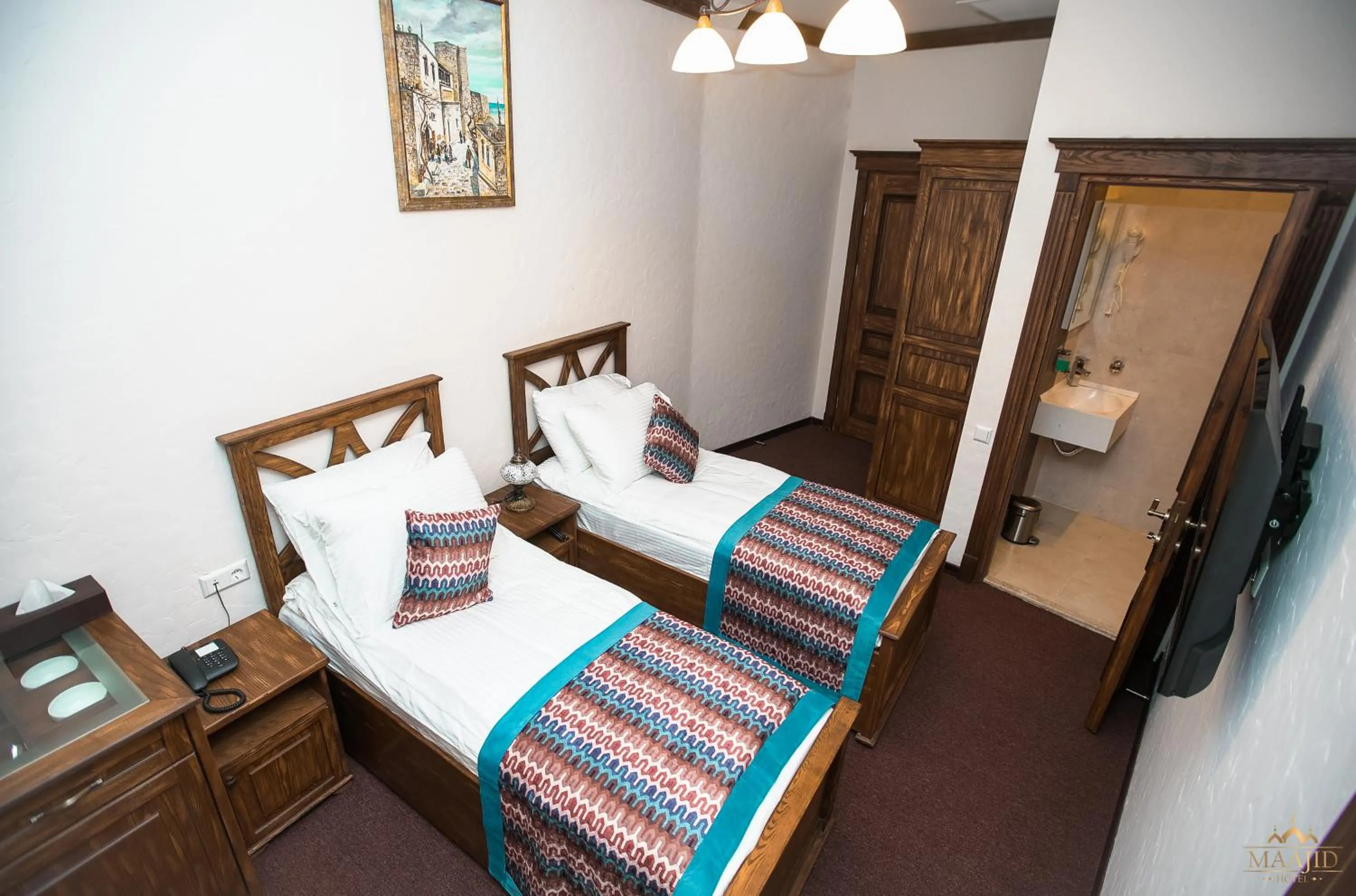 Bed in Maajid Boutique Hotel