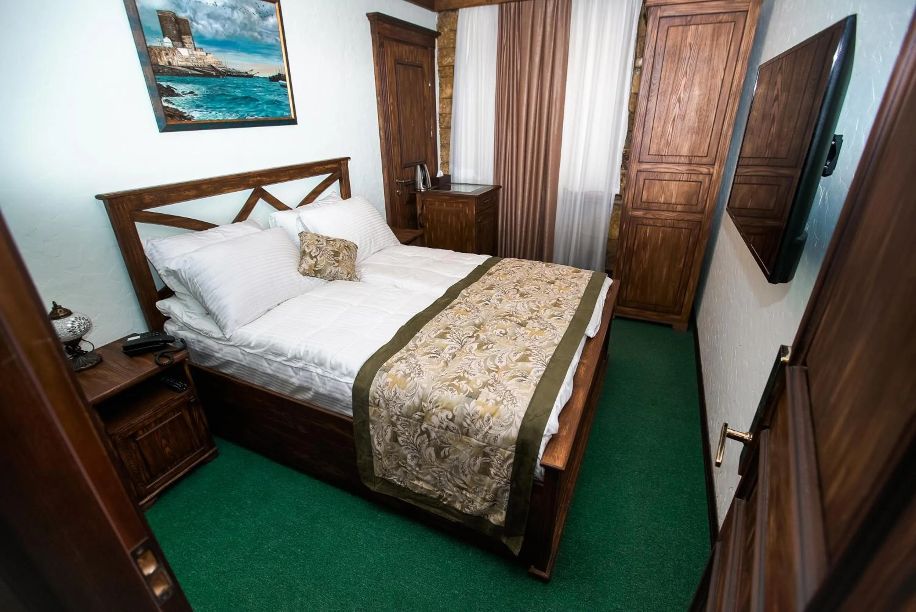 Bed in Maajid Boutique Hotel