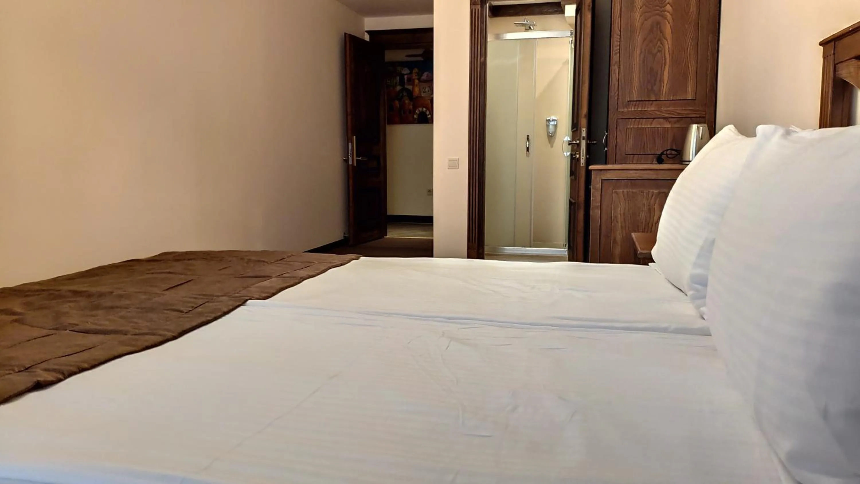 Bed in Maajid Boutique Hotel