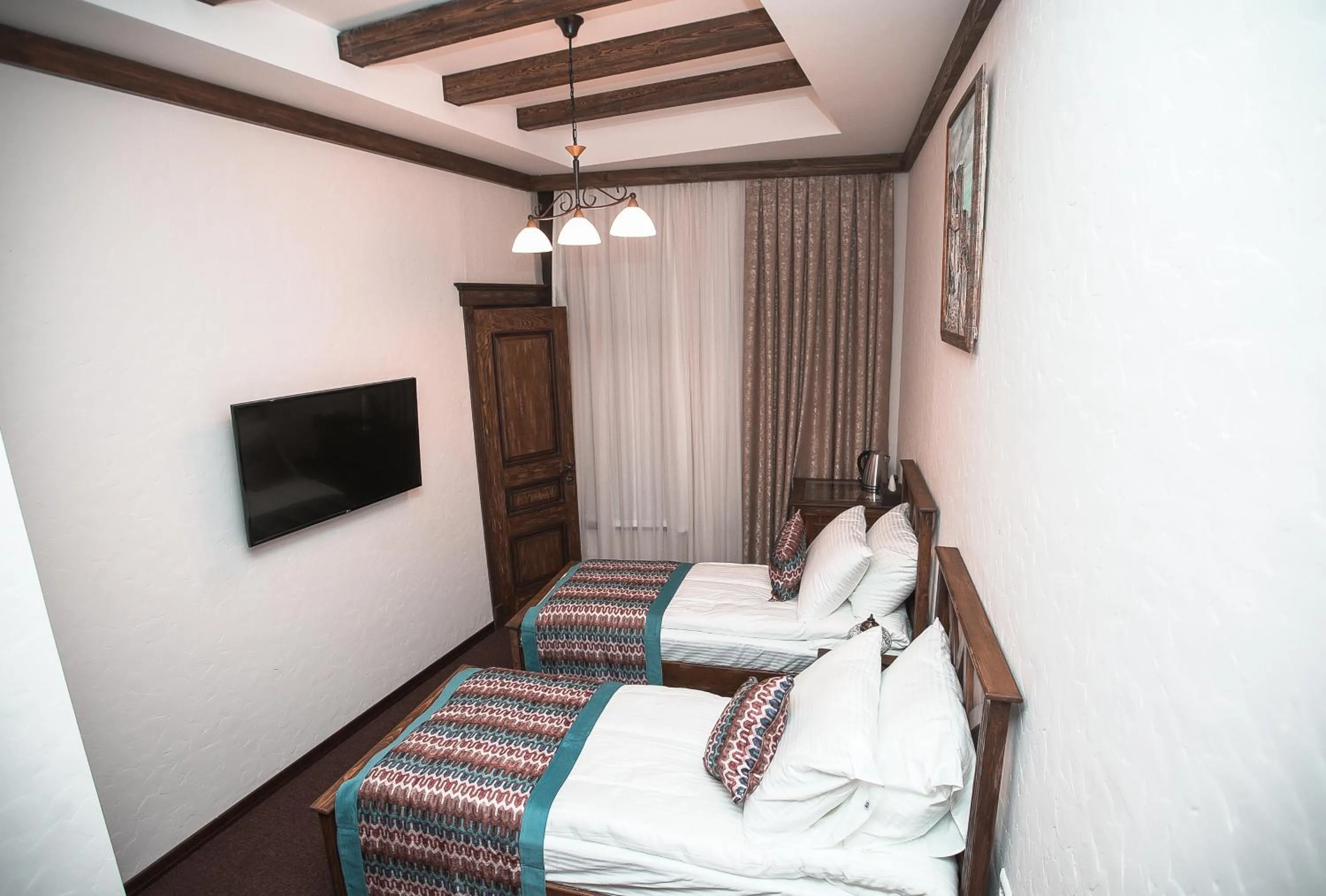 Bed in Maajid Boutique Hotel