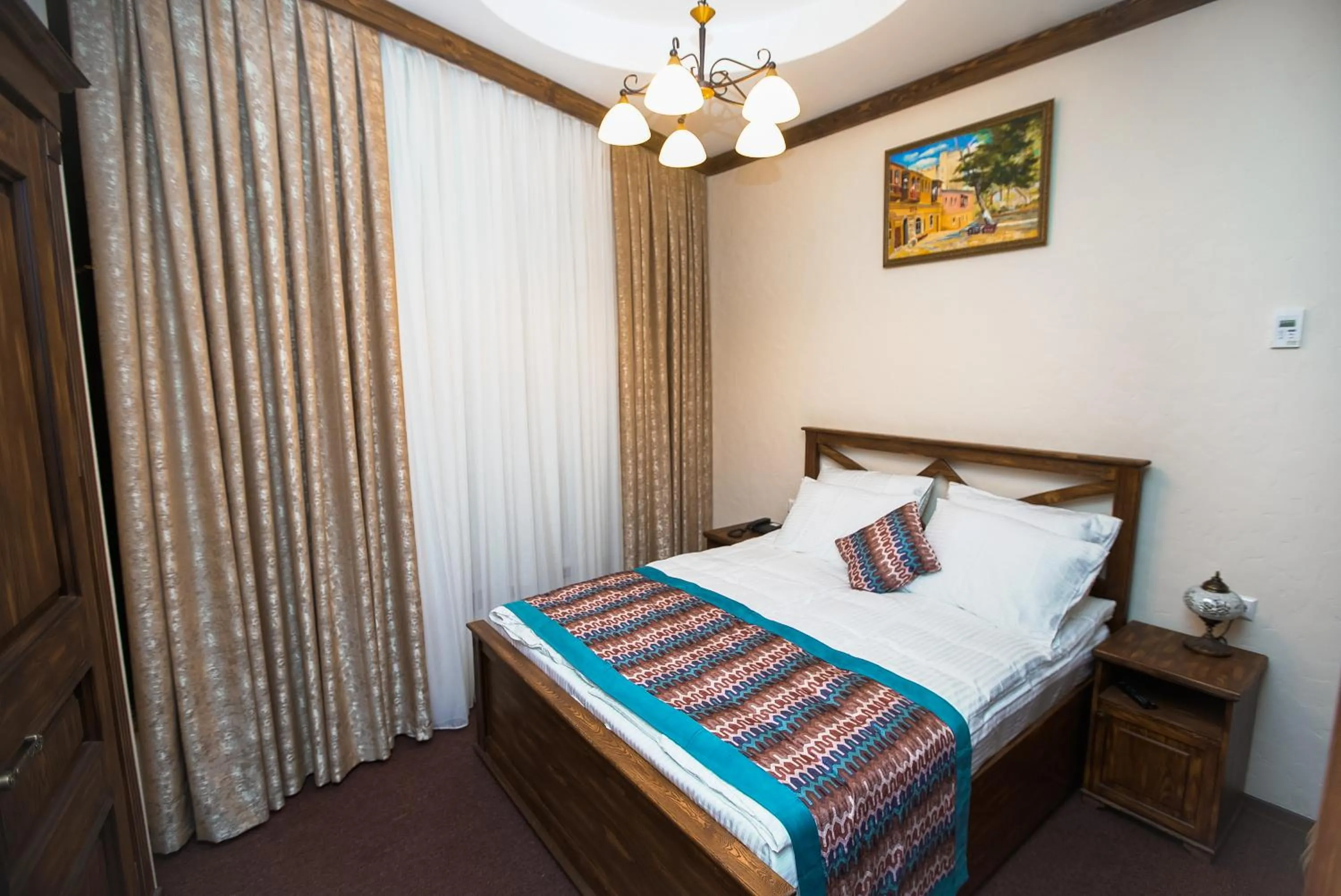 Bed in Maajid Boutique Hotel
