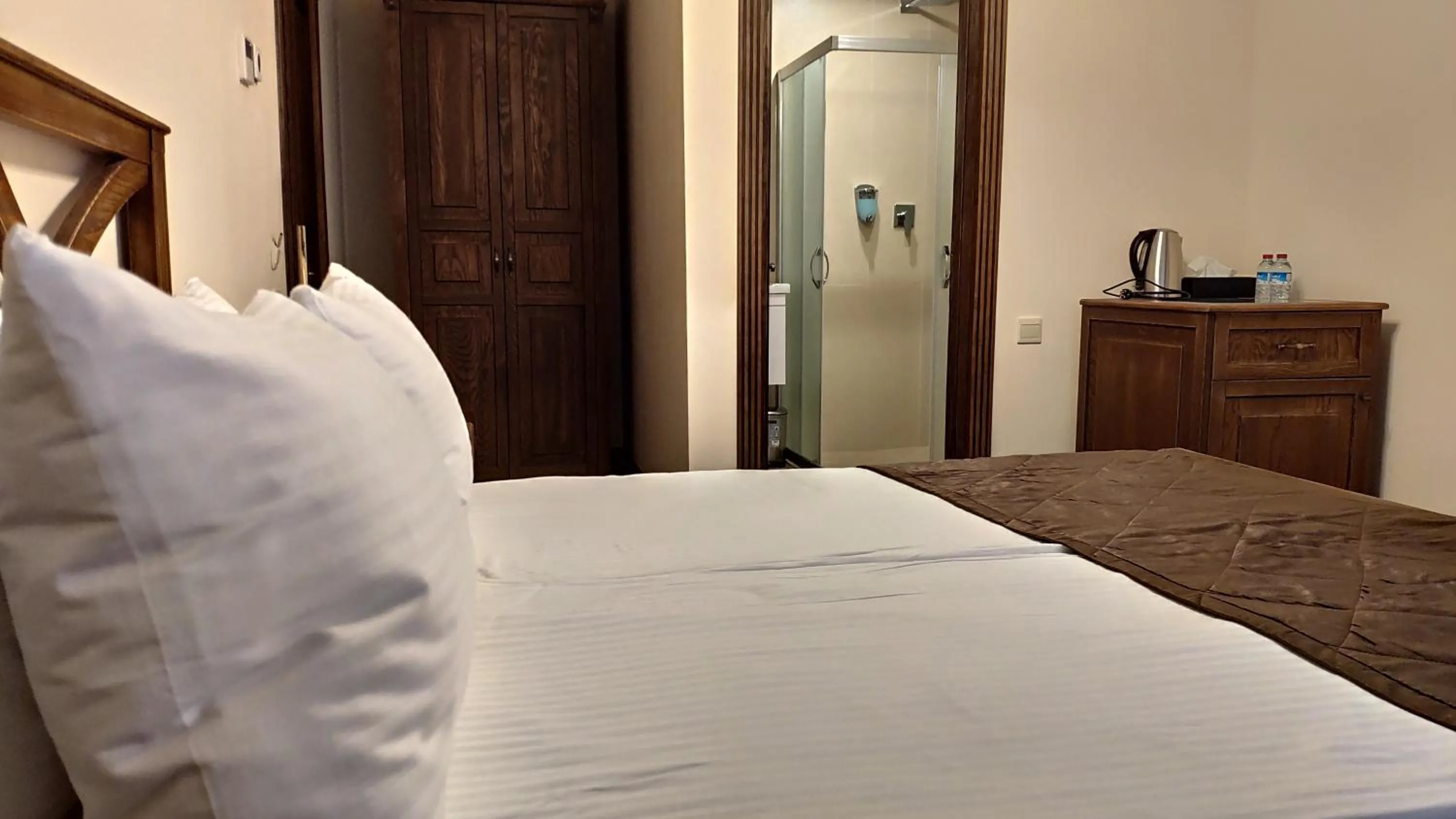 Bed in Maajid Boutique Hotel