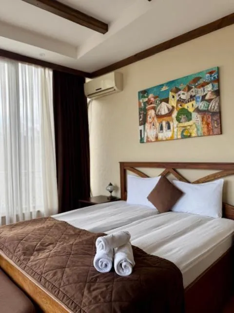 Bed in Maajid Boutique Hotel