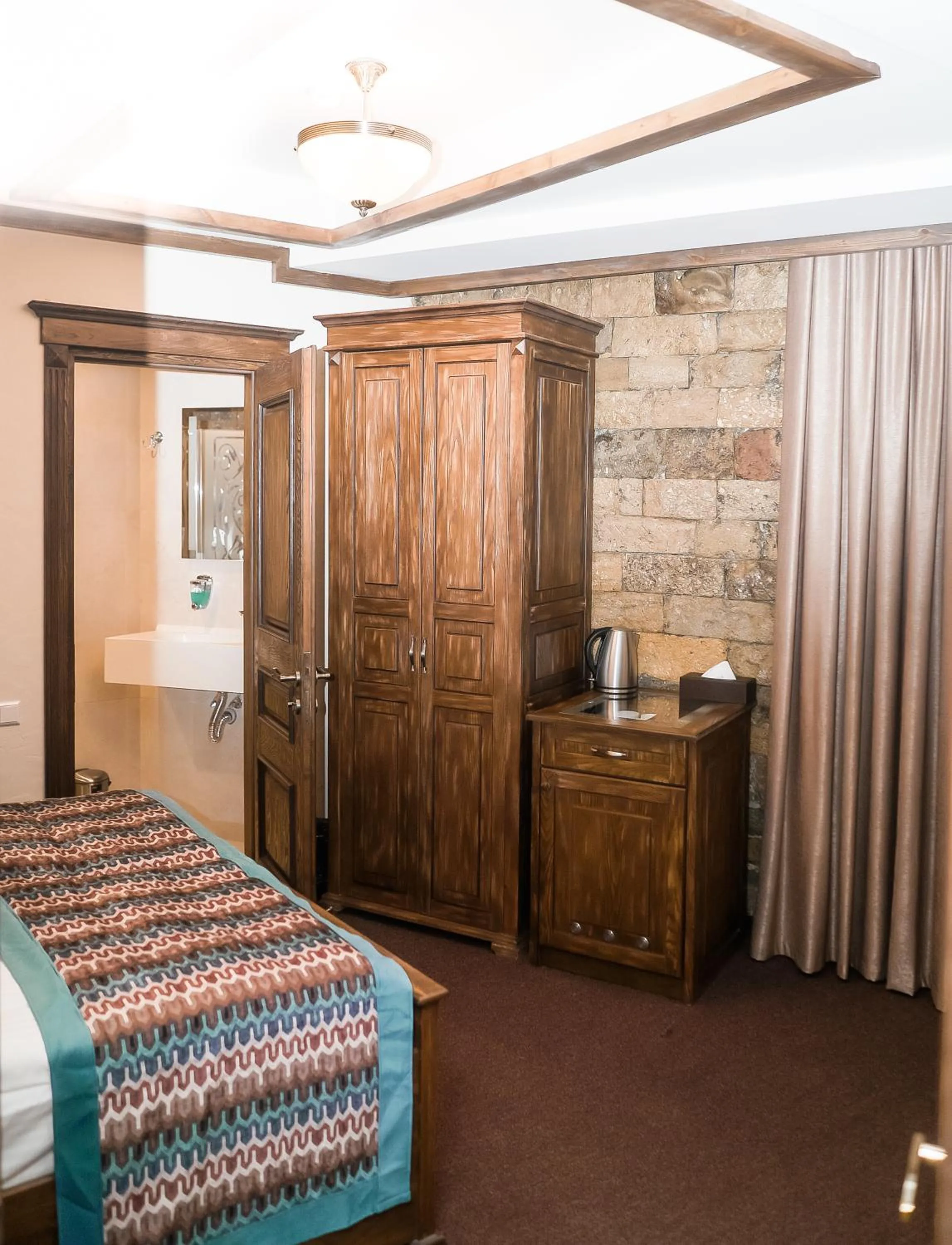 Bed in Maajid Boutique Hotel