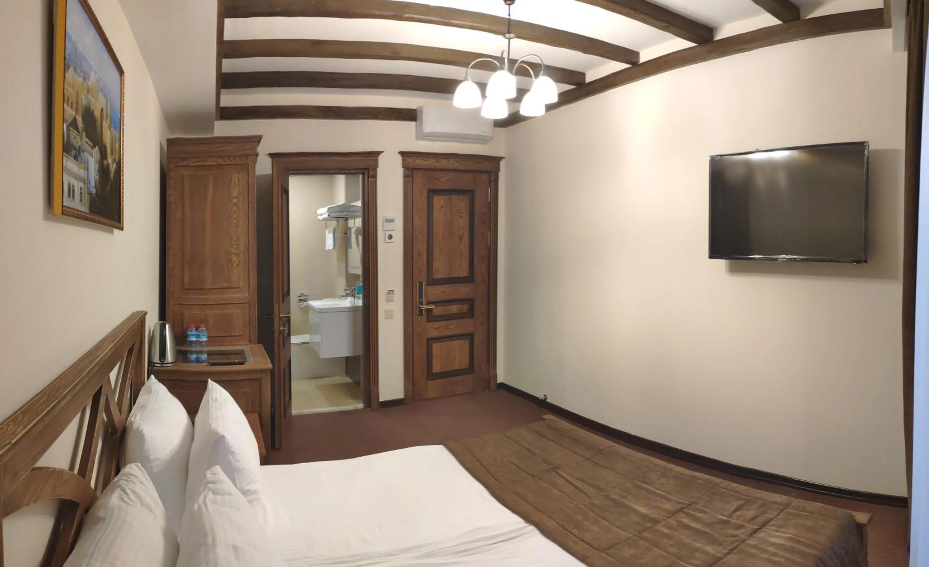 Bed in Maajid Boutique Hotel