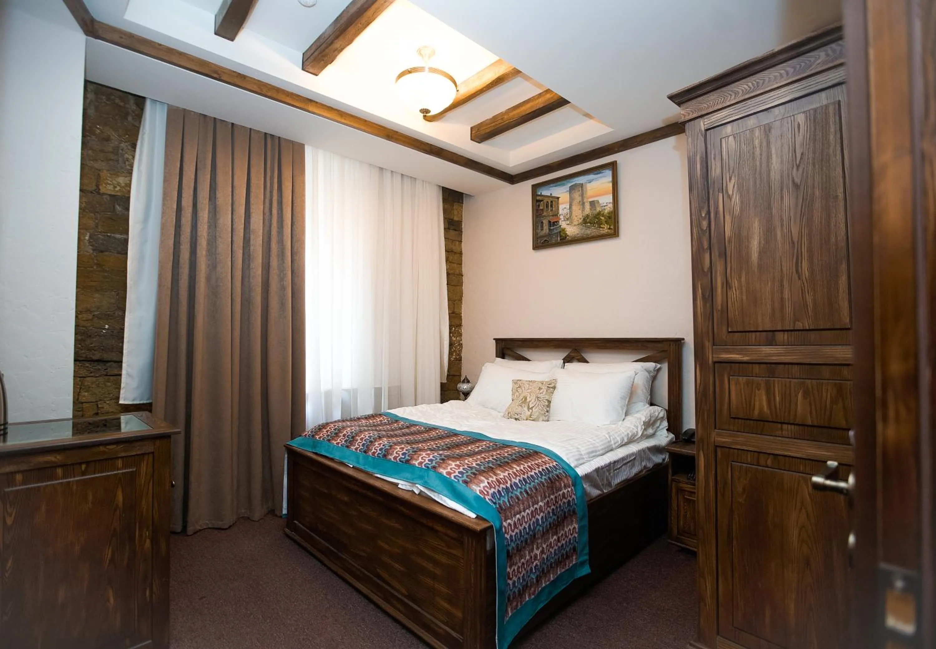 Bed in Maajid Boutique Hotel