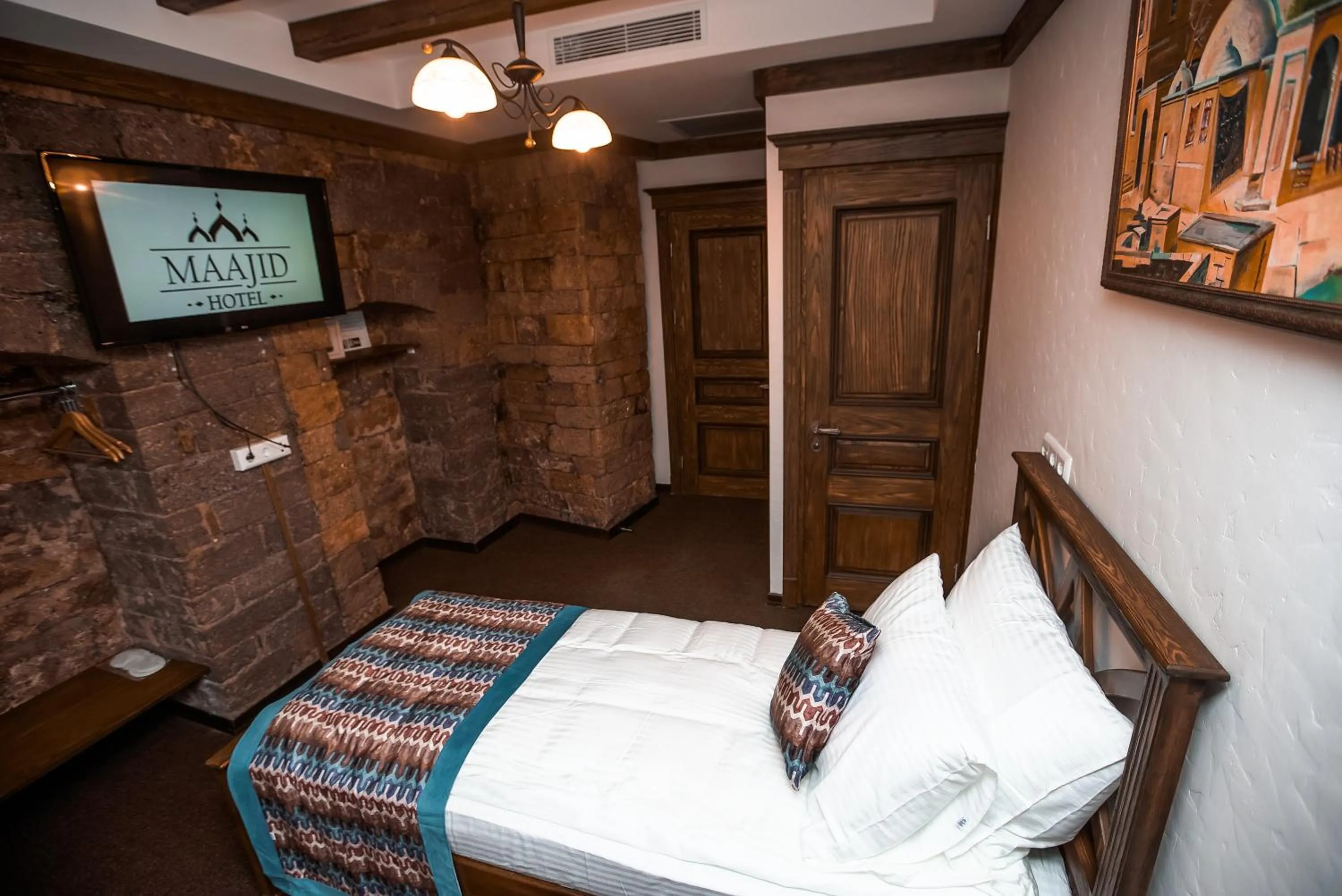 Bed in Maajid Boutique Hotel
