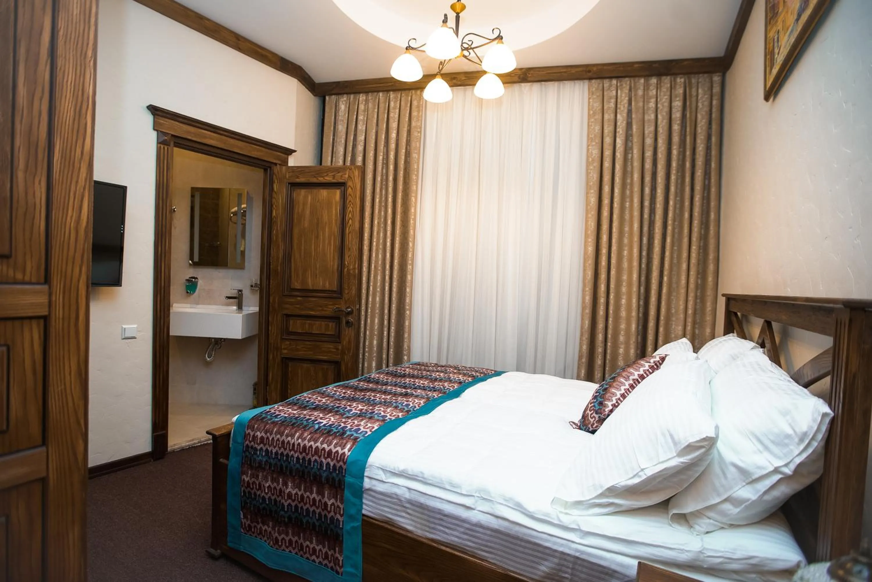 Bed in Maajid Boutique Hotel
