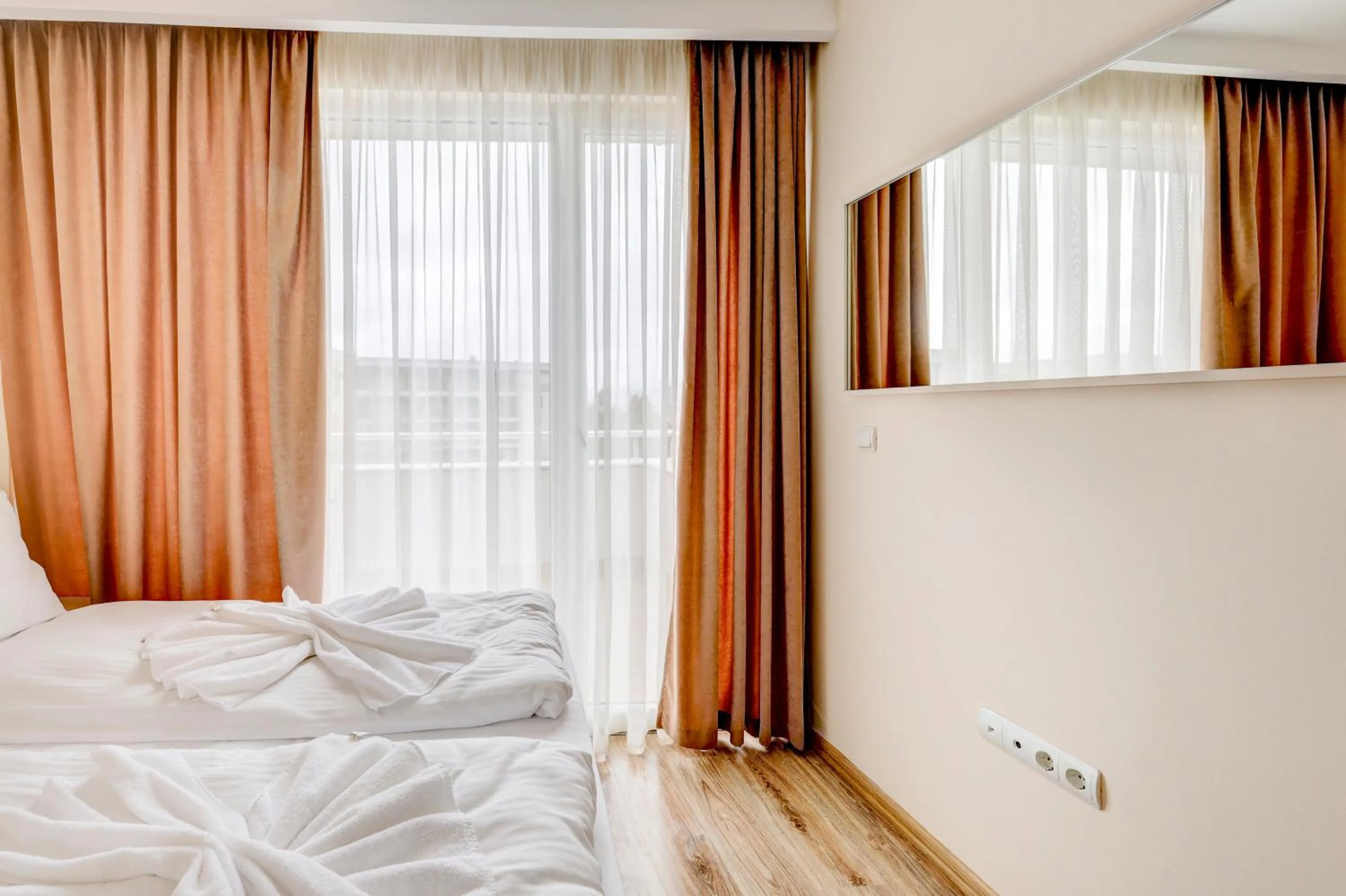 Bed in Jupiter 1 Family Hotel