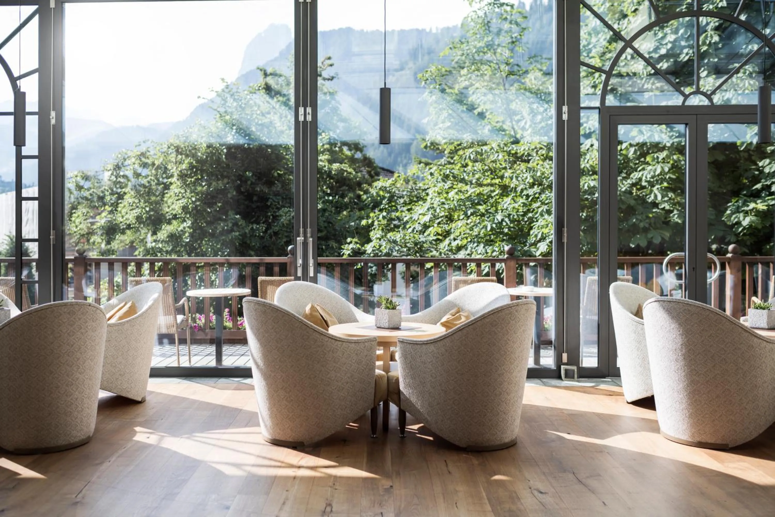 Communal lounge/ TV room in Adler Spa Resort Dolomiti