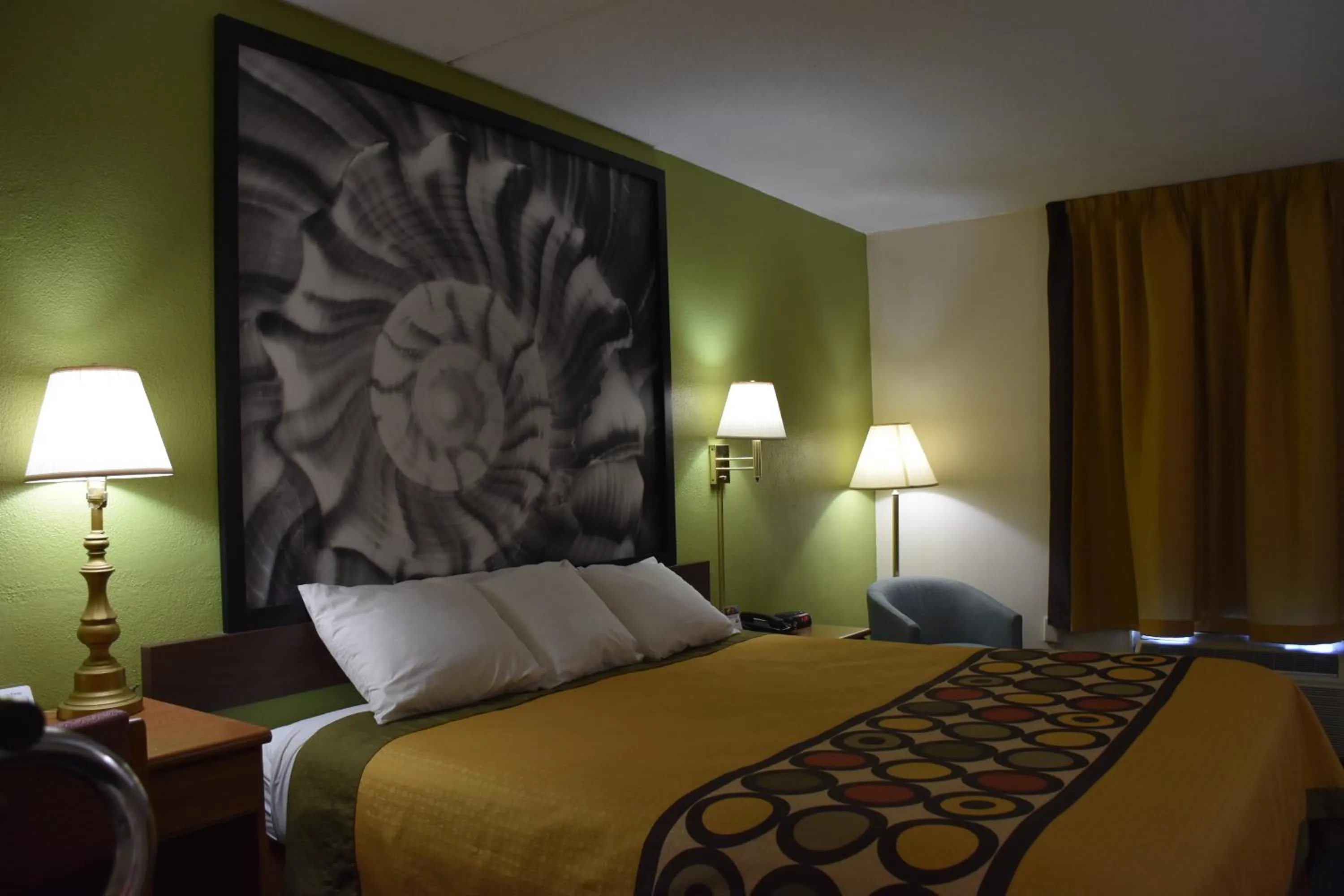 Decorative detail, Bed in Super 8 by Wyndham Tifton