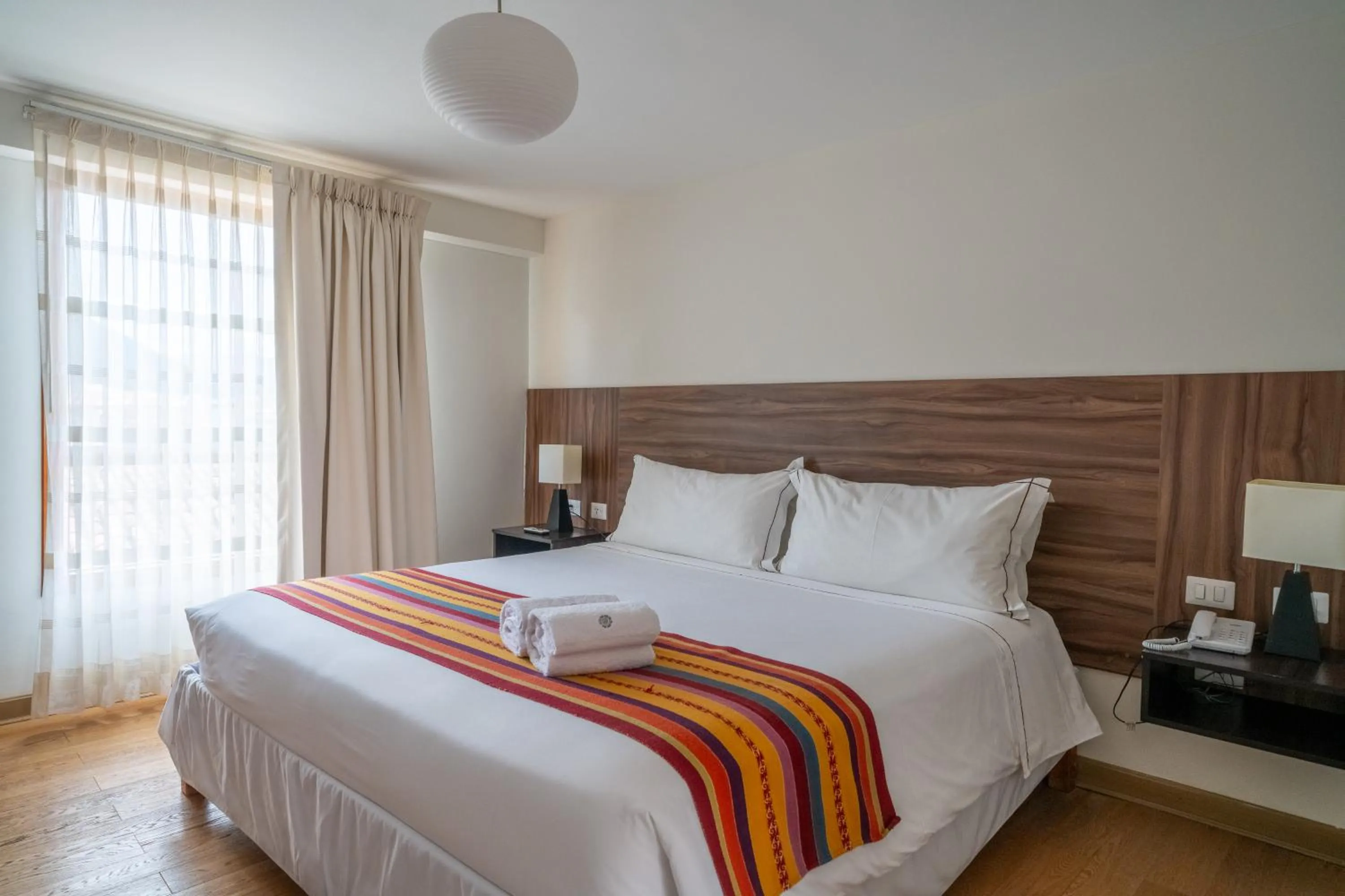 Bed in Taypikala Hotel Cusco