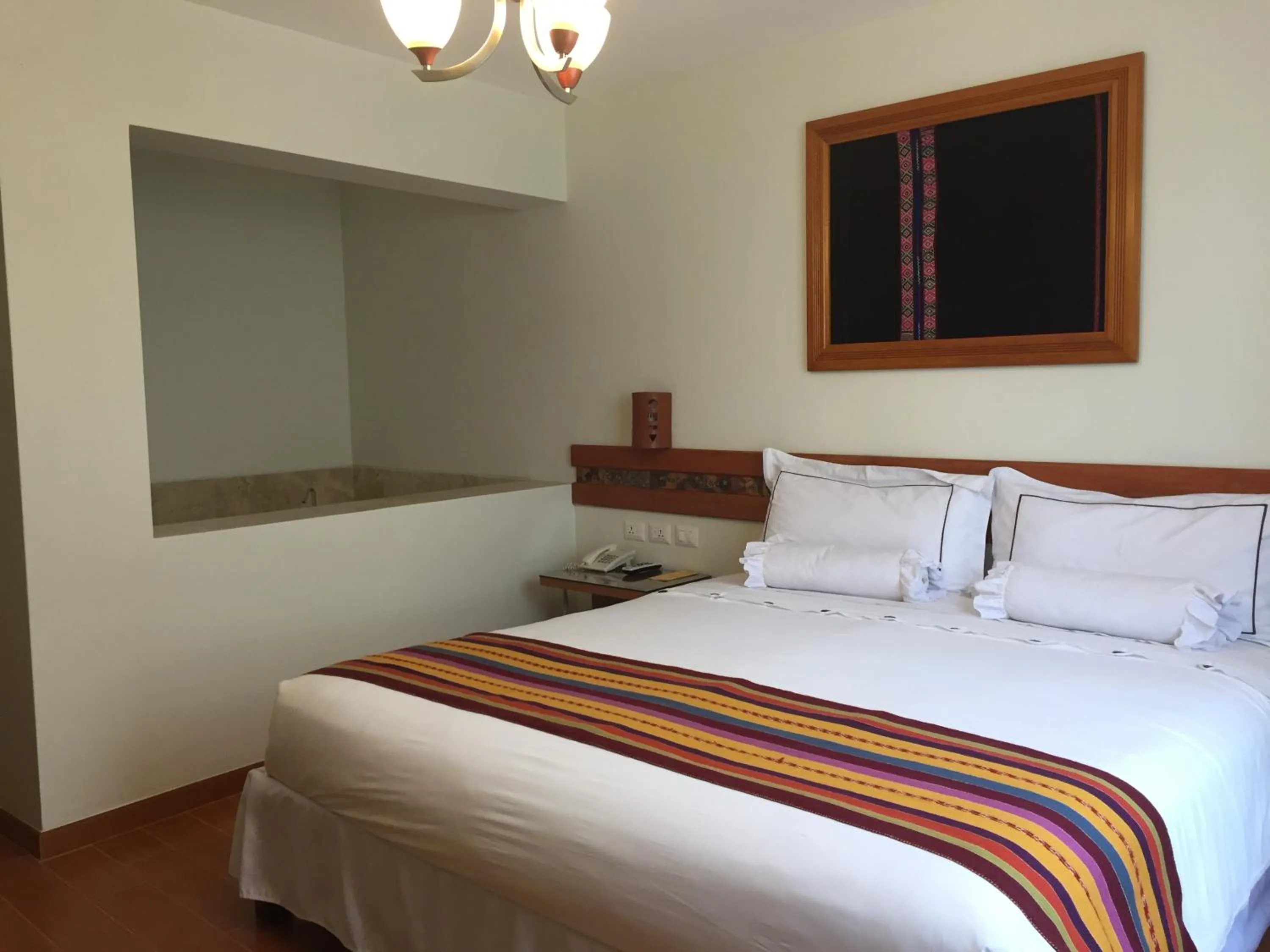 Bed in Taypikala Hotel Cusco