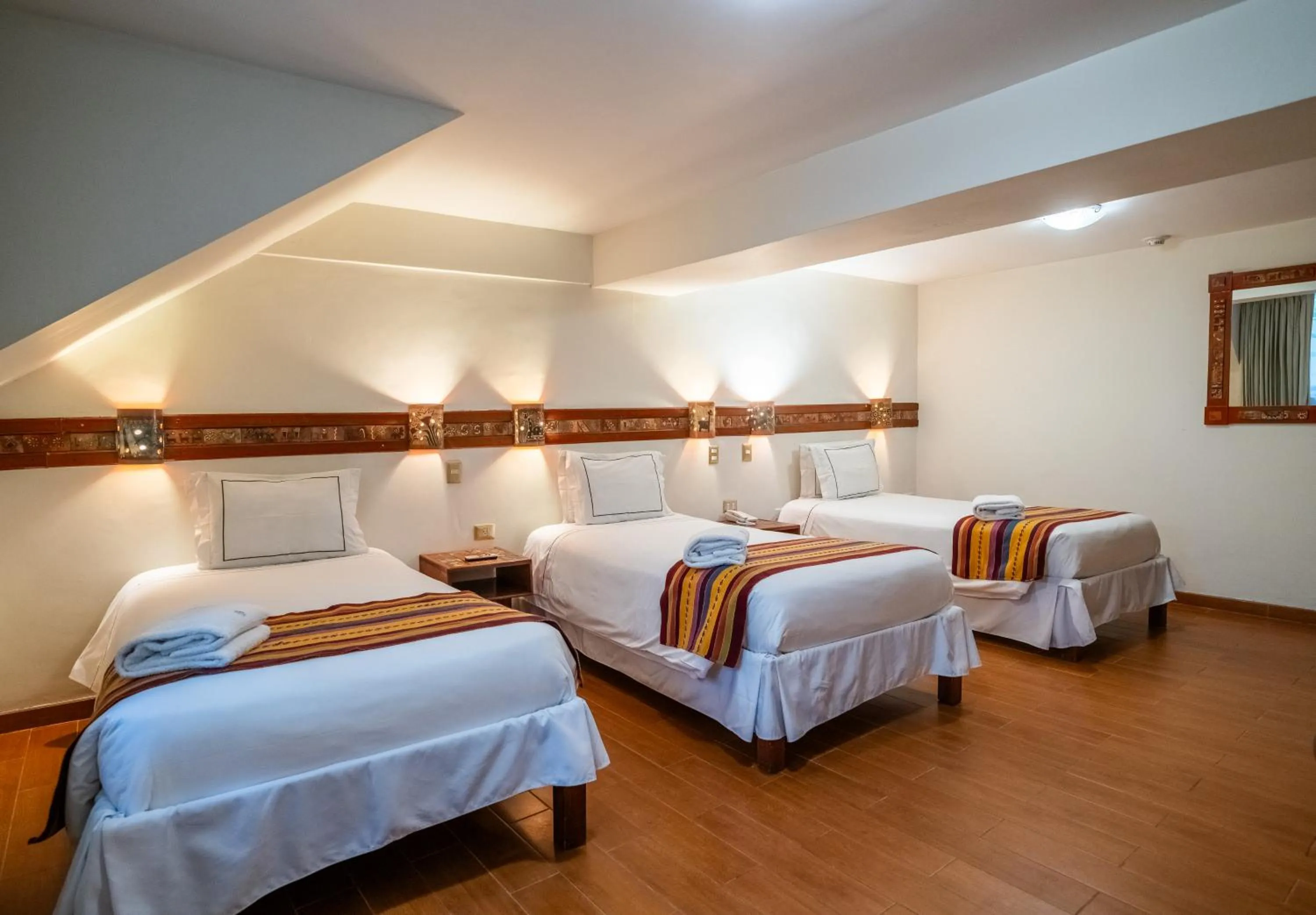 Photo of the whole room, Bed in Taypikala Hotel Cusco